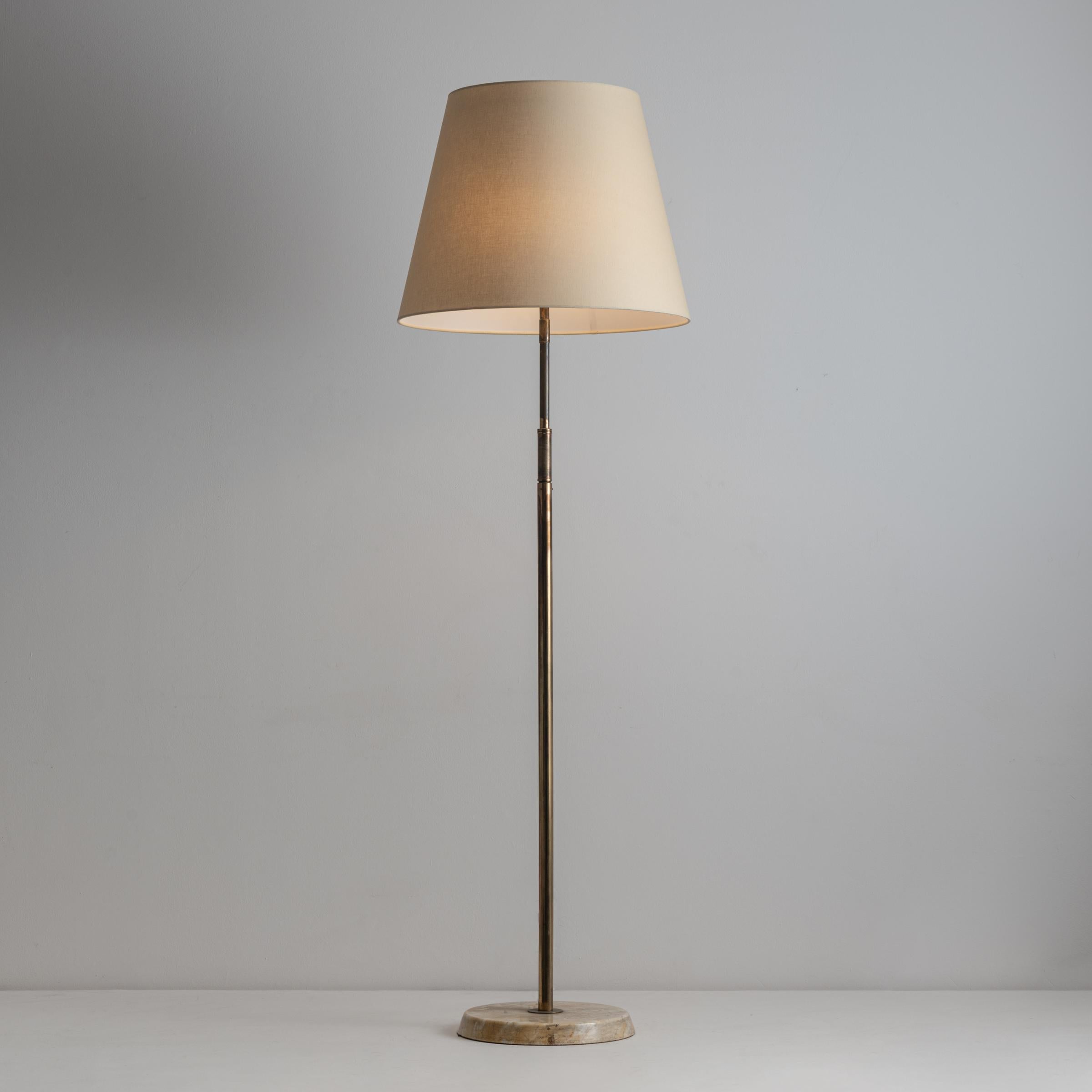 Tris Floor lamp by Angelo Lelli. Designed and manufactured in Italy, circa 1950's. Abalone, brass, custom linen shade. Recommended Lamping: 120v - 3 Qty E27 Sockets w/ 60w Frosted Bulb, Bulbs not included. US Plug Measures: H: 99.5
