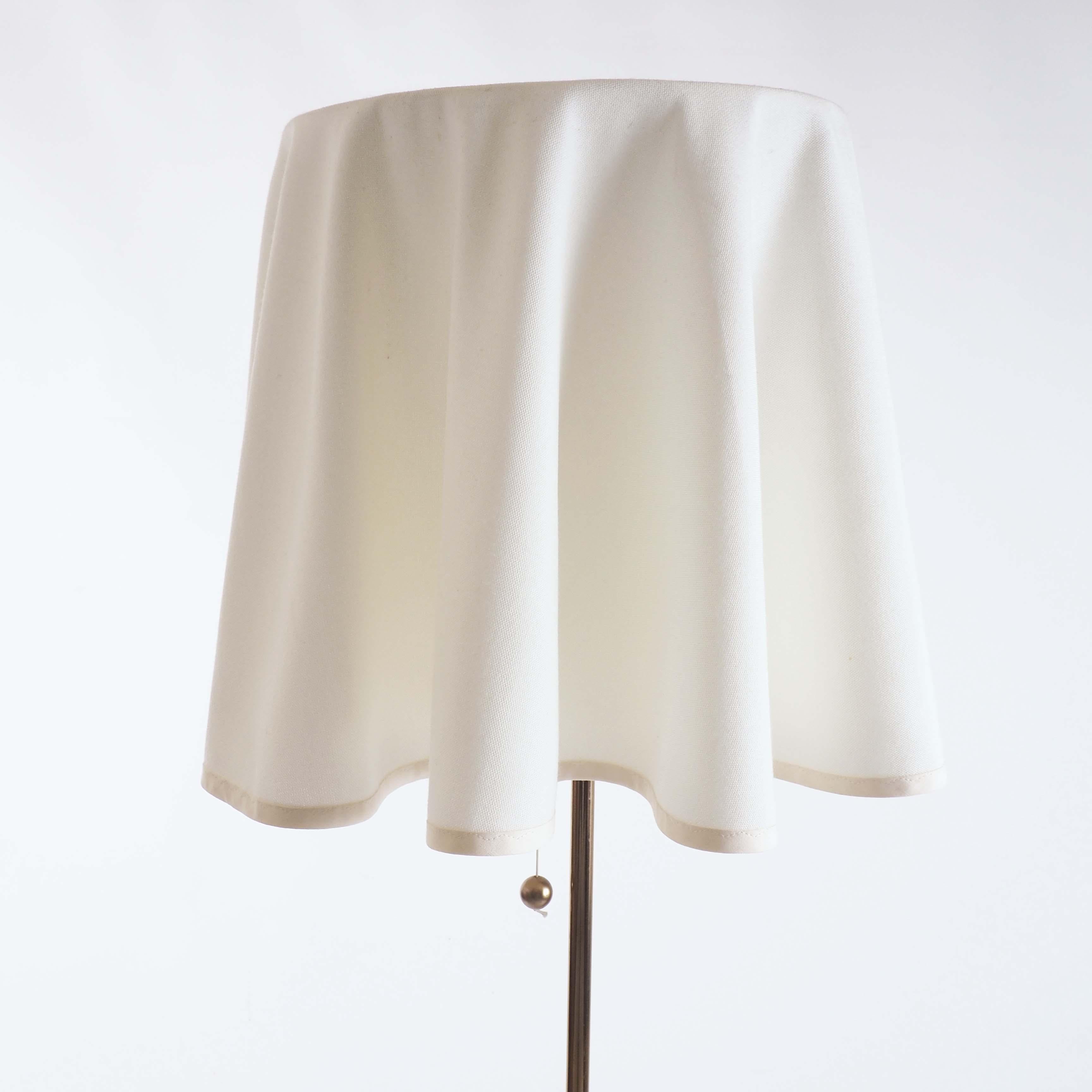 Floor lamp by Bergboms, Sweden in brass and original fabric.