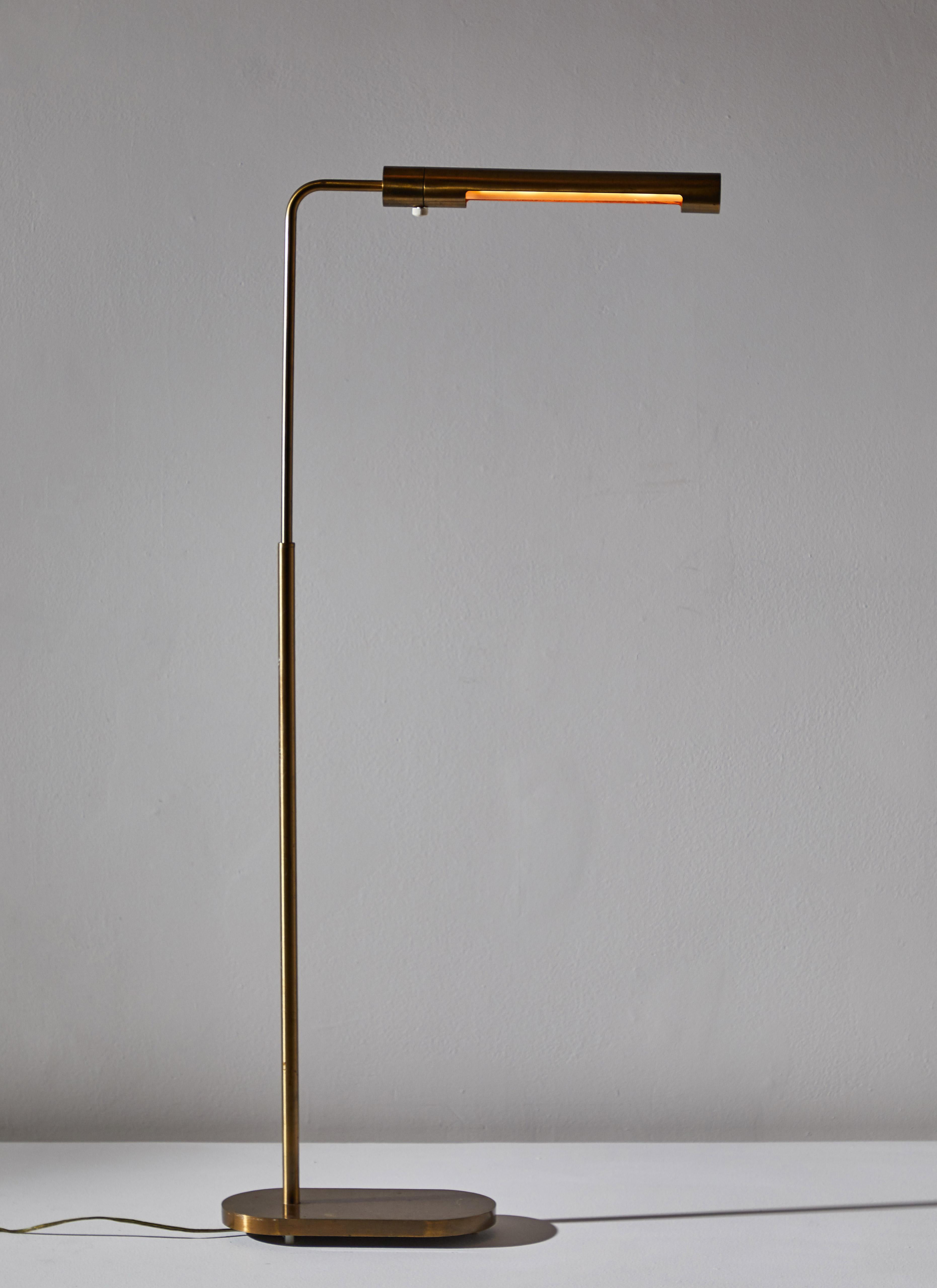 Floor Lamp by Casella. Manufactured in the U.S. circa 1970s. Solid brass with adjustable height. Takes one E26 100w maximum bulb. This model no longer in production. Bulb provided as a one time courtesy.