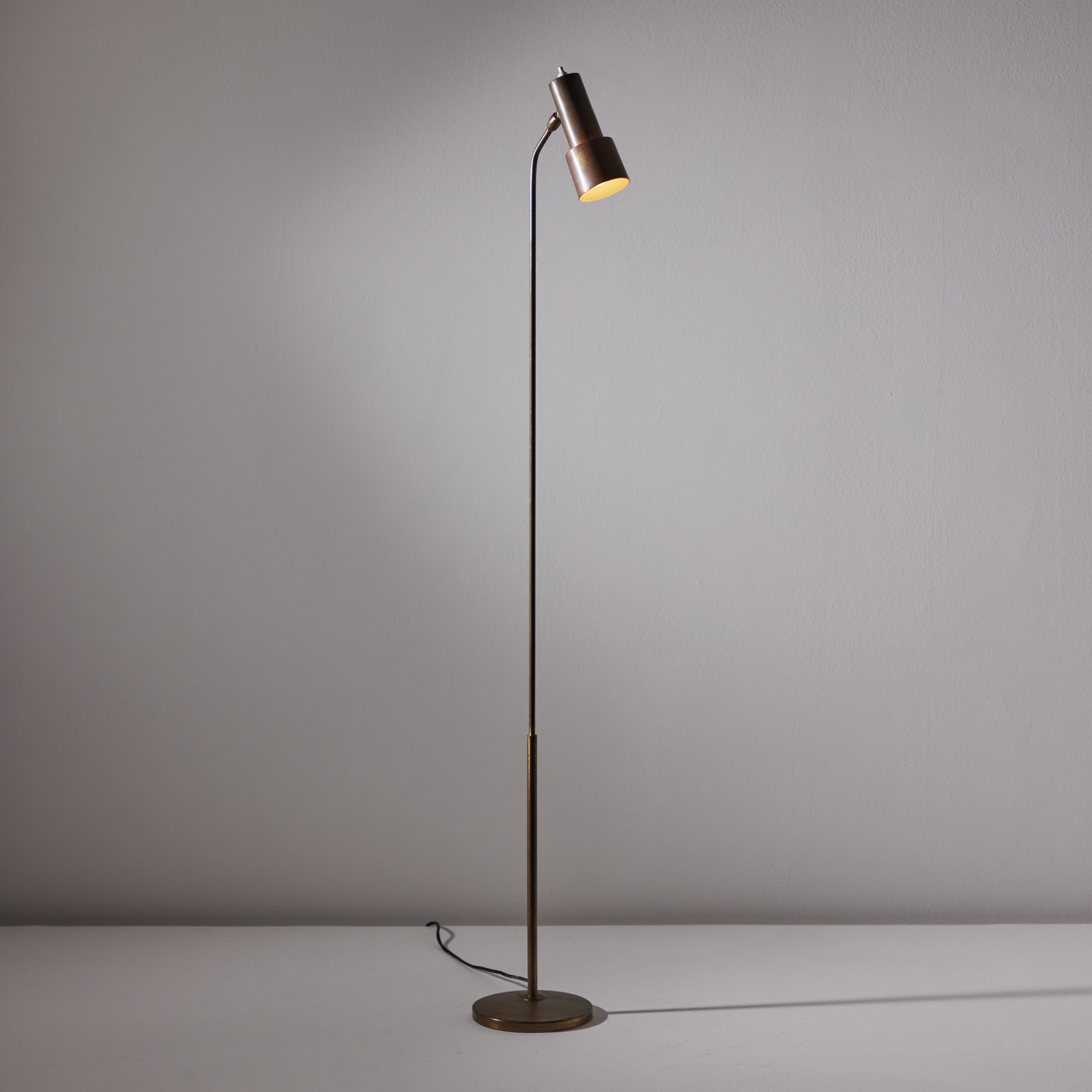Model 1968 Floor Lamp by Fontana Arte. Manufactured in Italy, circa the 1950s. Enameled metal and brass. Original cord. Shade pivots to various positions. Takes one E27 60W maximum bulb. Bulb provided as a one-time courtesy. Literature: Bibliography