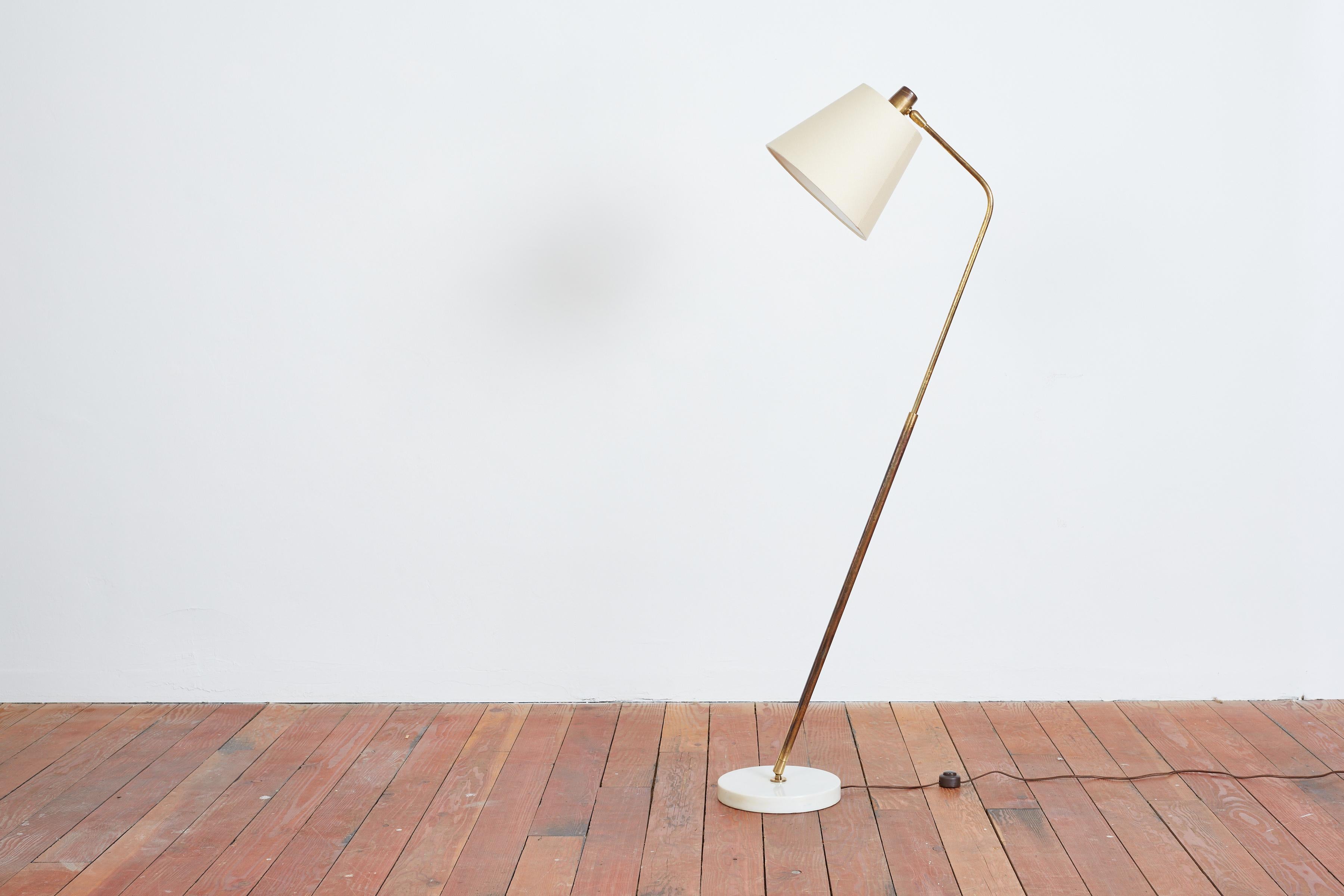 Beautiful floorlamp by Giuseppe Ostuni 
Produced by O-Luce, Italy, 1950s
Carrera marble base with burnished brass stem and new silk shade. 
Adjustable /tilting mechanism that allows lamp to move in all directions 
Bulb Specifications: E-26 Bulb