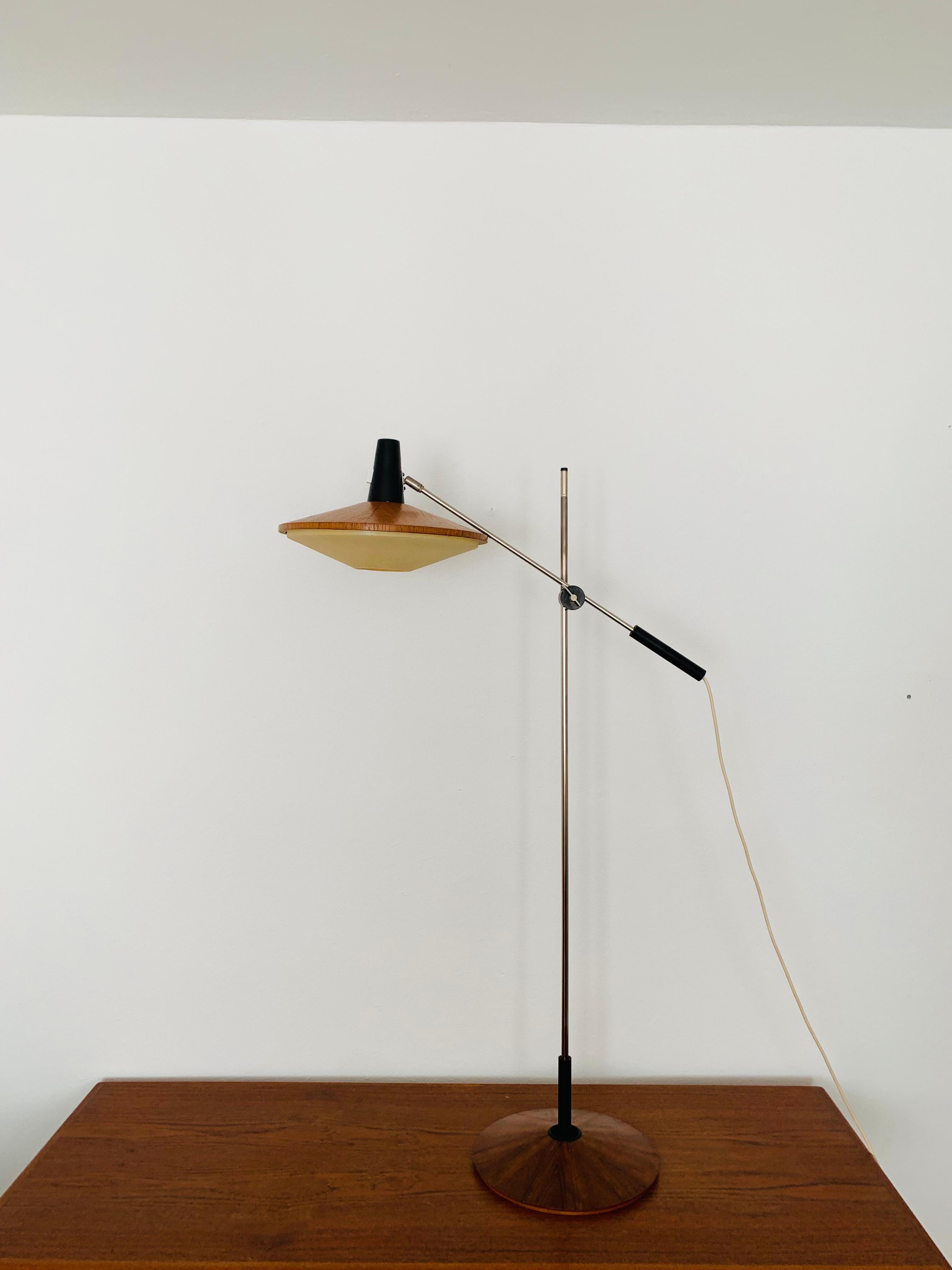 Exceptionally beautiful and very rare architect's floor lamp from the 1960s.
The design is very unusual.
The shape and the materials create a warm and very pleasant light.

Design: Georges Frydman

Condition:

Very good vintage condition with slight