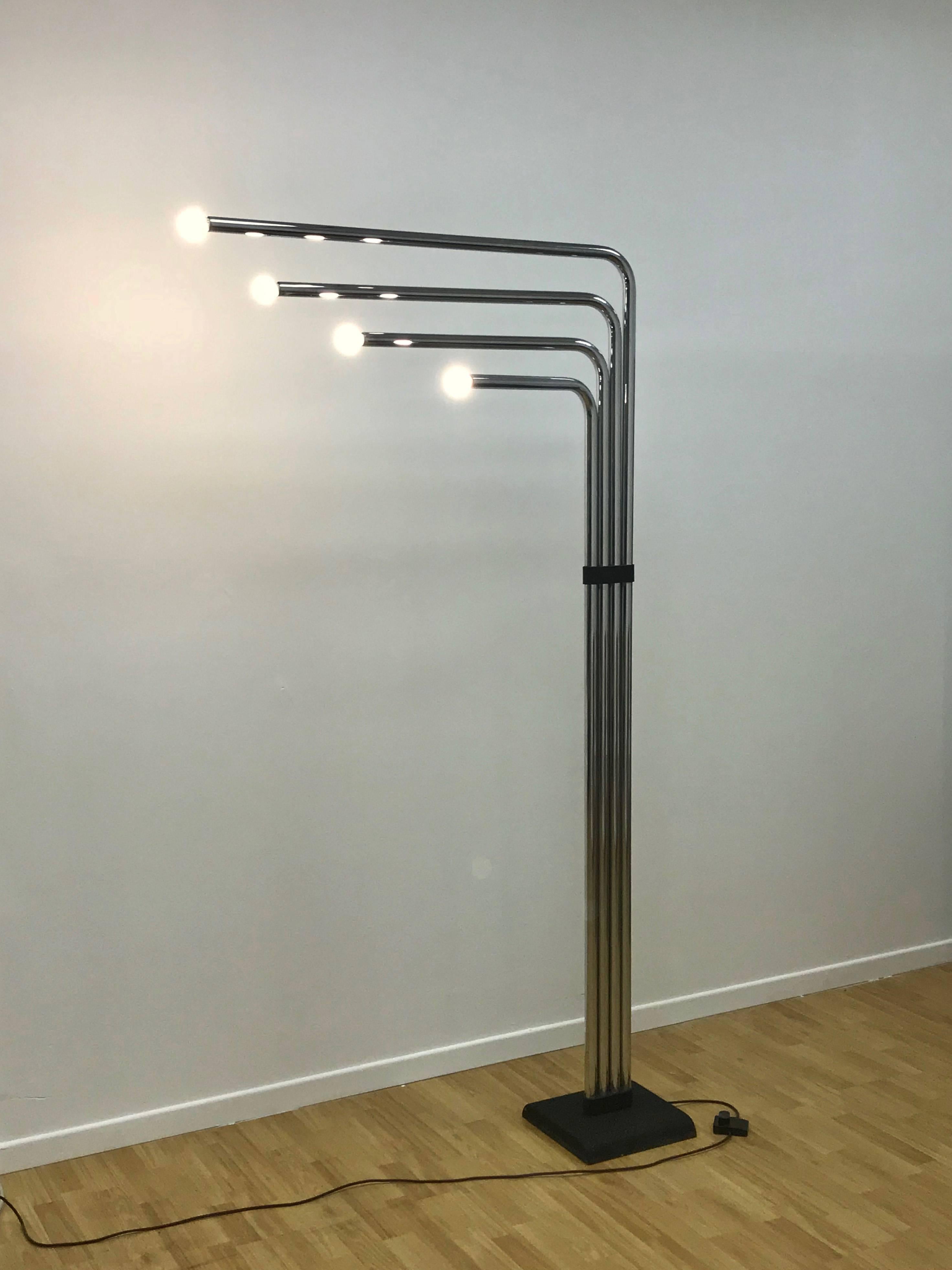 Architectural floor lamp in chromed metal made by Reggiani. It is the tallest lamp the manufacturer ever made and has four modular arms and lights.