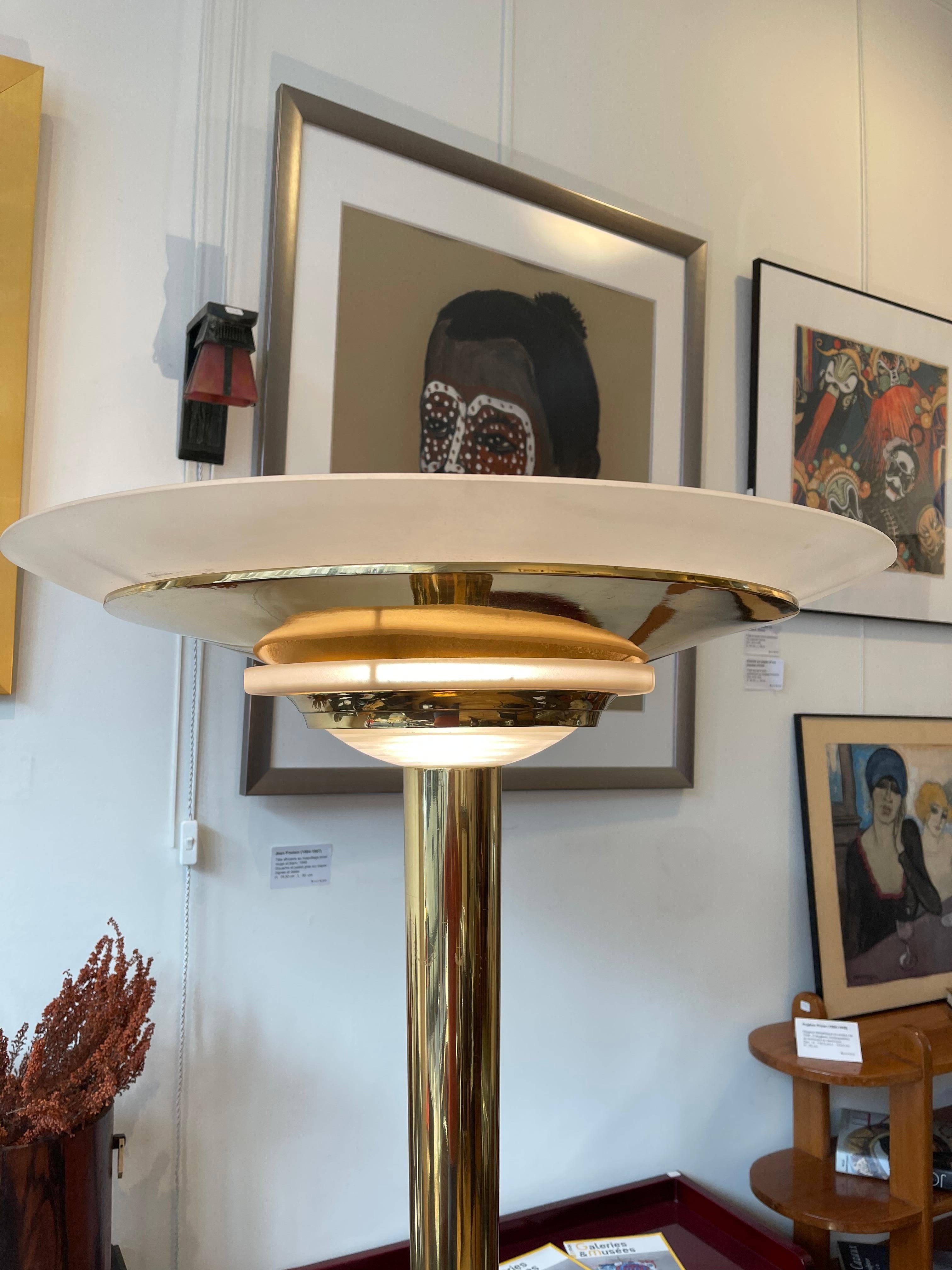 Iconic floor lamp by Jean Perzel, Model 41 E GM. Floor lamp made of gild brass and frosted glass. Signed on the base. Dimensions: hight 172cm, diameter of base 45cm, diameter at the top: 64.5cm
Jean Perzel is the most famous lamp maker of the