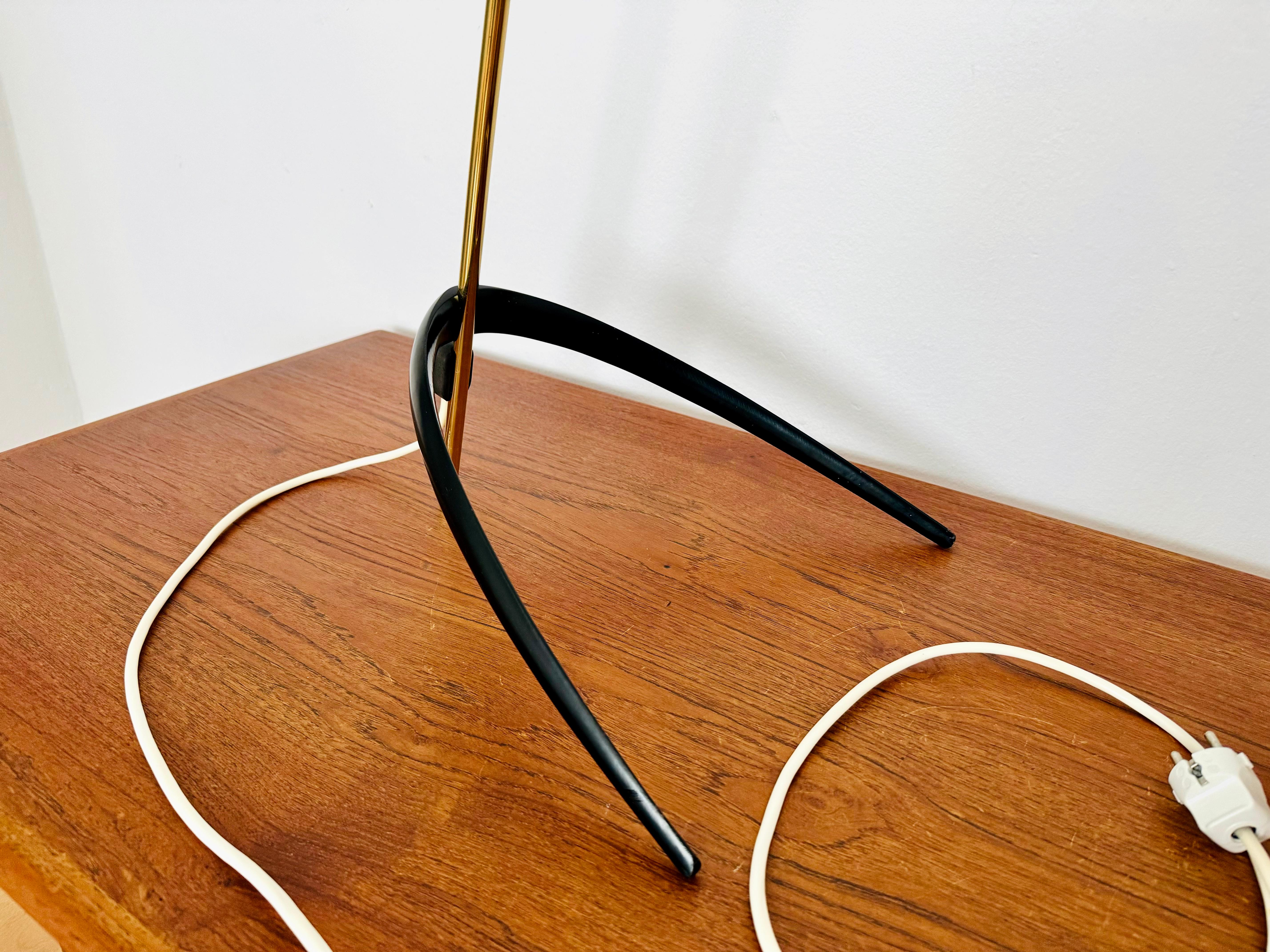 Exceptionally beautiful and very rare floor lamp from the 1950s.
The design is very unusual and particularly elegant.
The shape and materials create a warm and very pleasant light.

Design: Christian Dell
Manufacturer: Kaiser Idell

Condition: