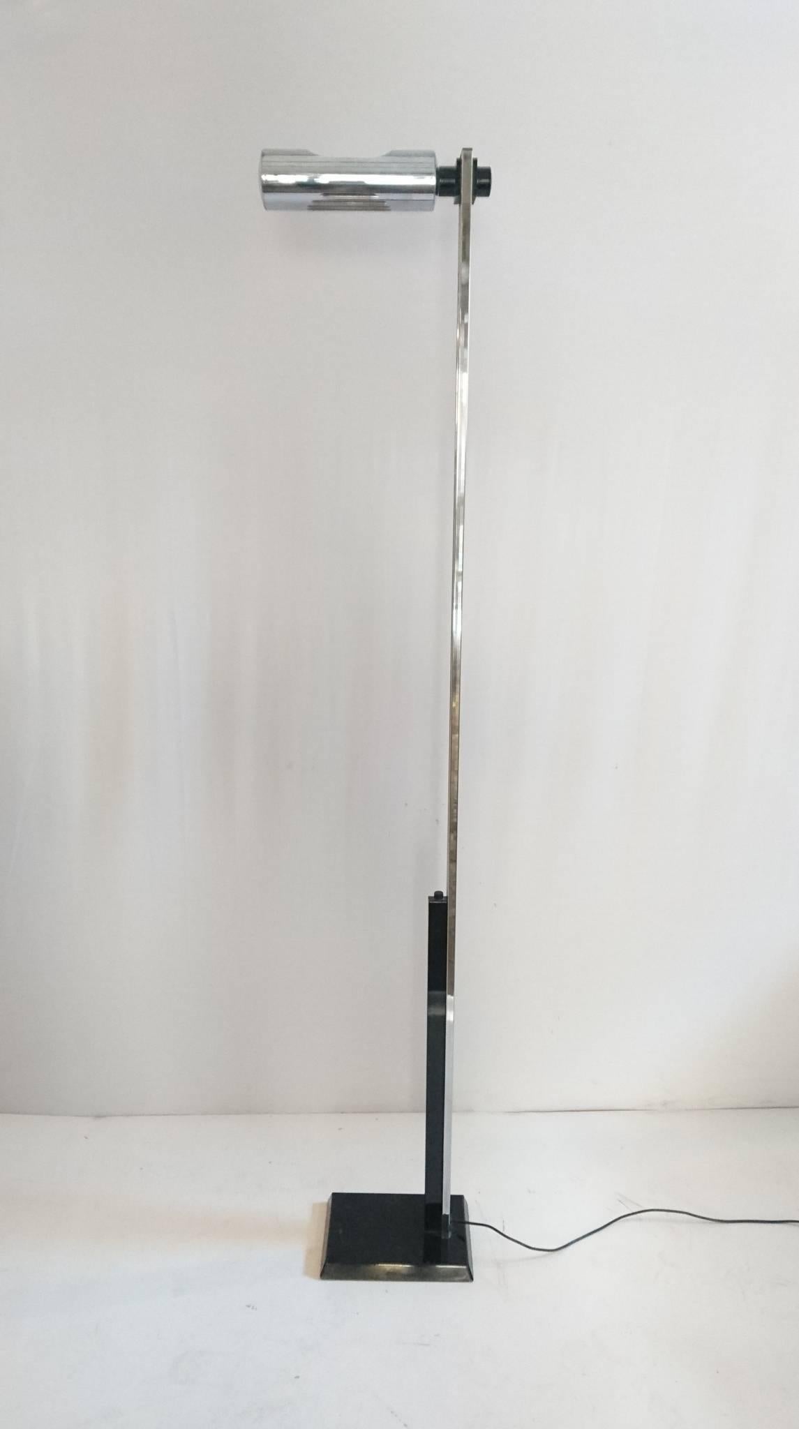 Floor lamp in chrome and black metal with a lamp which is fully adjustable in height and direction. Very nice condition.