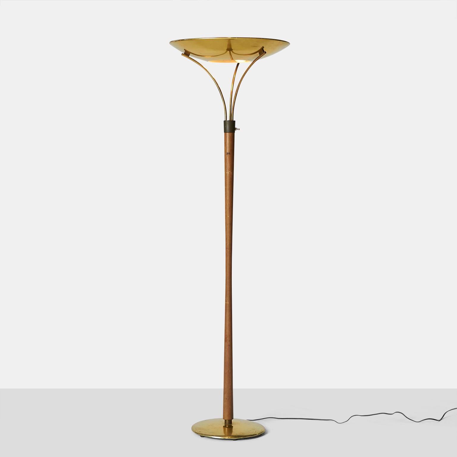 A beauty in the rough.
This brass and hard wood floor lamp is in need of a little TLC and then it will shine again!
Brass is in great condition but may want a little polish. Hardwood color and grain is beautiful but needs a light cleaning and we