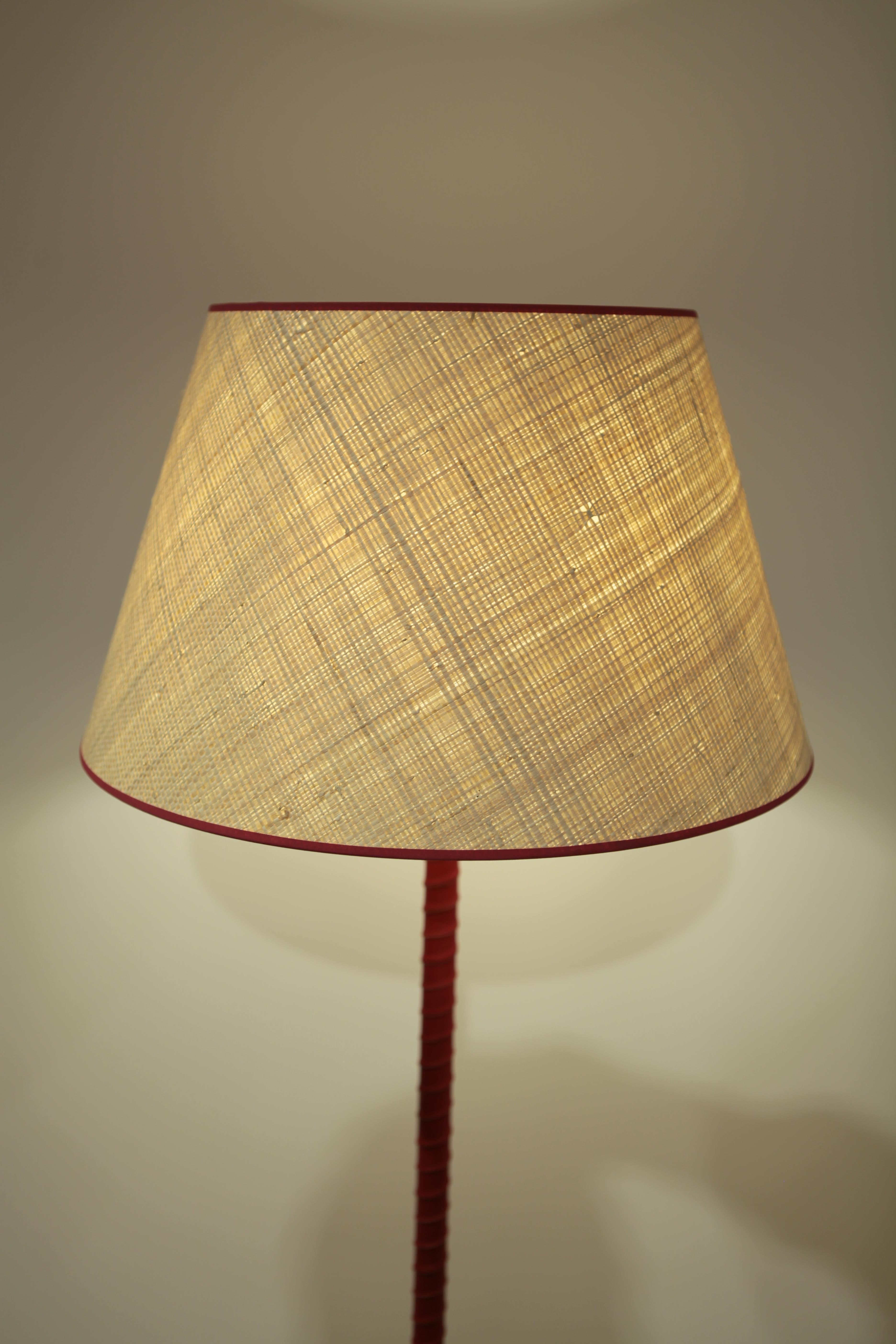 Lisa Johansson-Pape, floor lamp manufactured by Orno in Finland in the 1940s.
Brass base and red leather covered pole.
Handmade Raffia shade with red trimming.
Excellent condition.