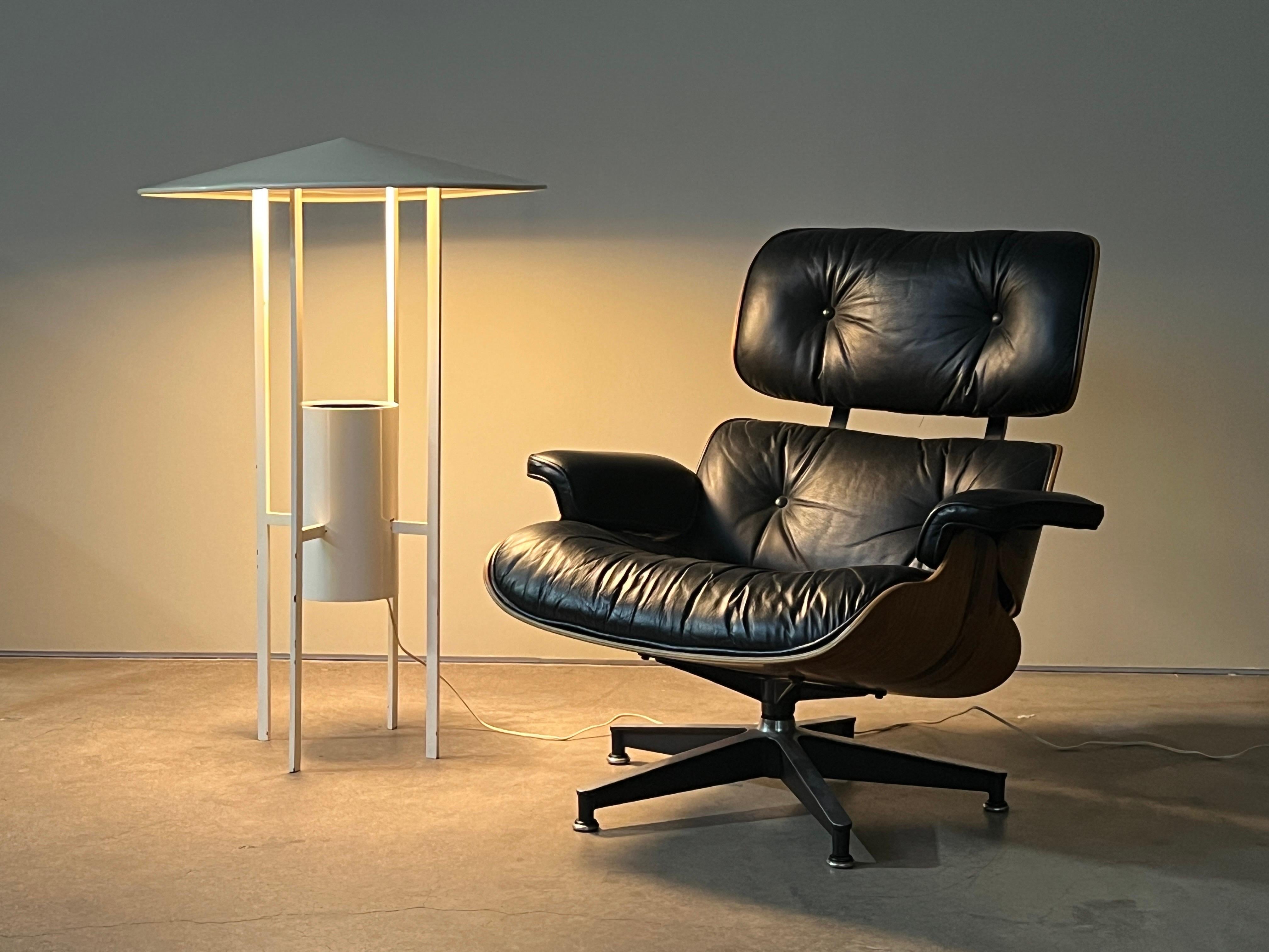 A rare and iconic floor lamp designed by Philip Johnson and Richard Kelly and produced by Edison Price. This example retains its original white lacquer. 