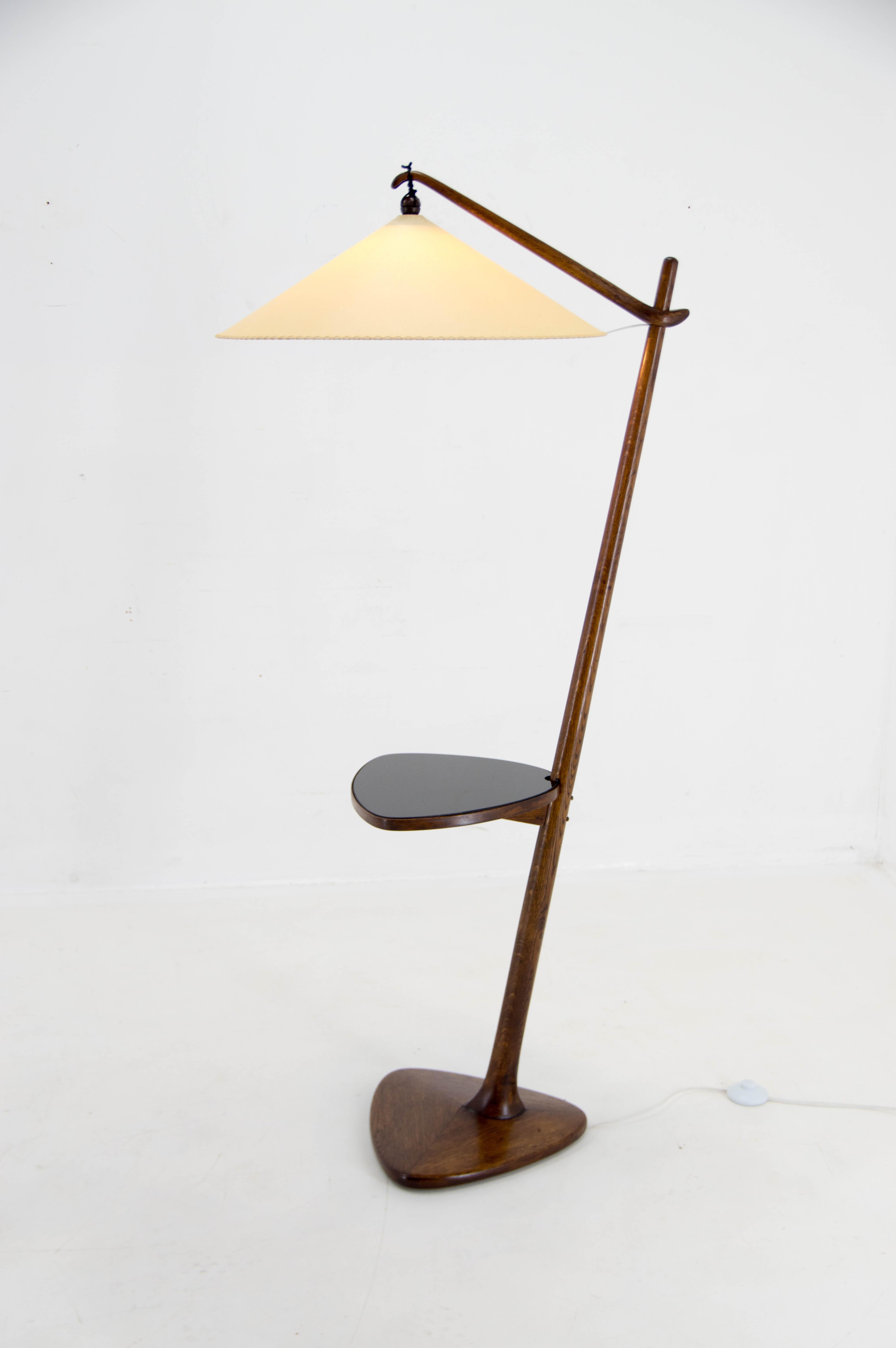 Iconic floor lamp designed by Vaclav Rada for Krasna Jizba in 1930s.
Wooden parts have been refinished, new shade made of parchment paper.
New glass table in black or creamy white according to the client's decision.
Rewired: 1x40W, E25-E27 bulb
US
