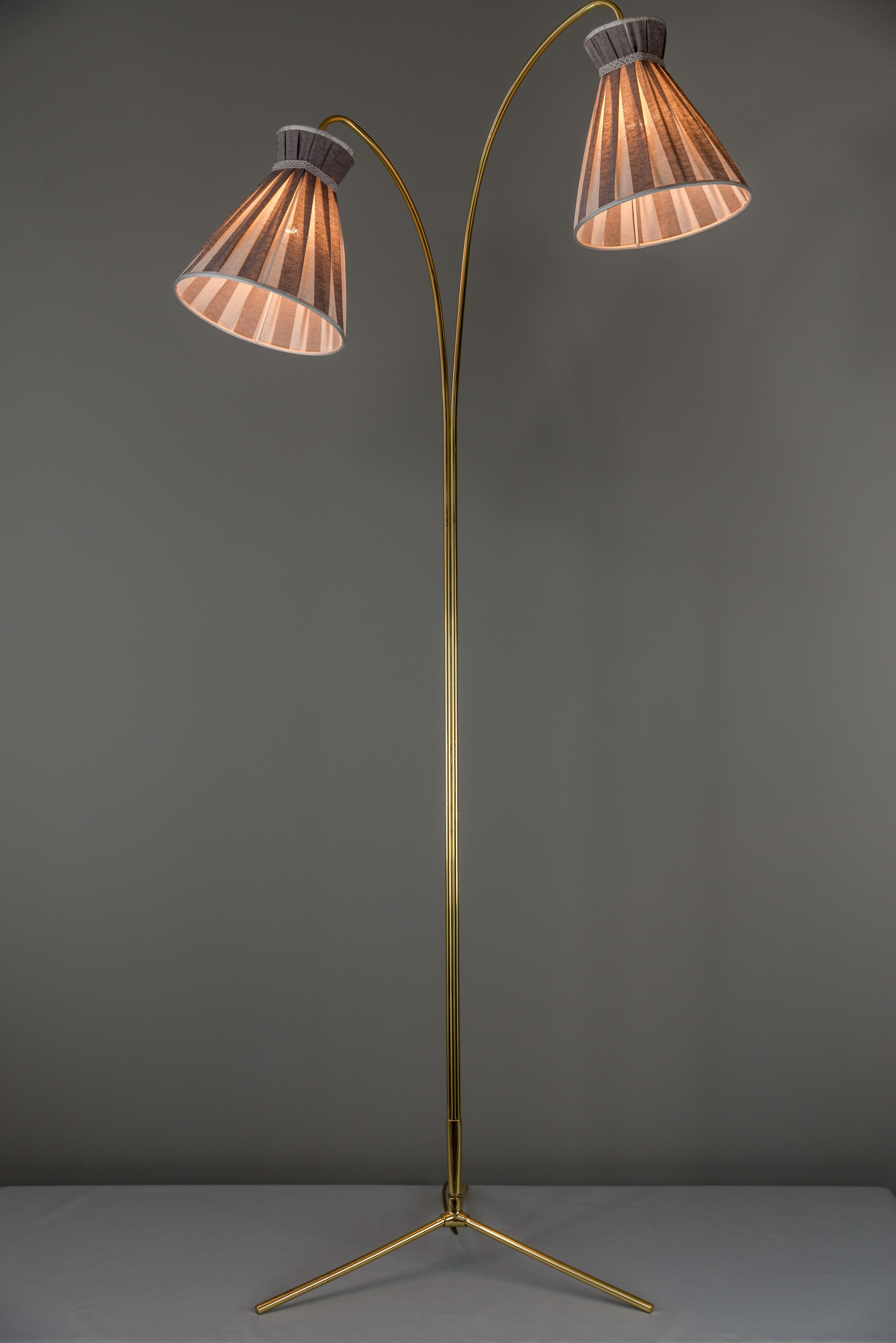 Floor lamp by Rupert Nikoll, circa 1950
Polished and stove enameled
The shades are replaced (new)
It is possible to turn on or off the left or right light separately.