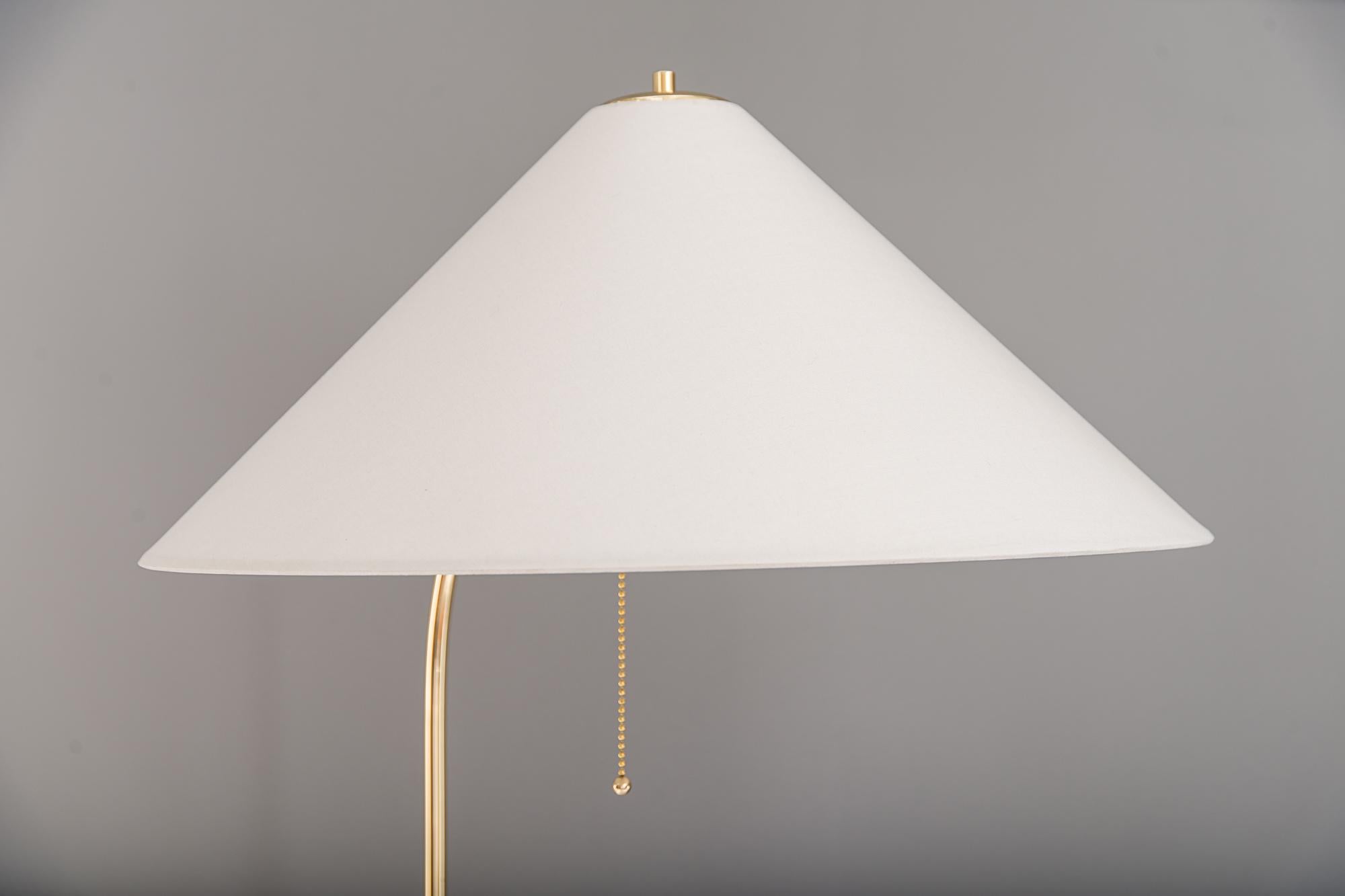 Floor lamp by Rupert Nikoll, Vienna, 1950s
Polished and stove enameled
The lamp shades have been renewed as well based on the original dimensions.