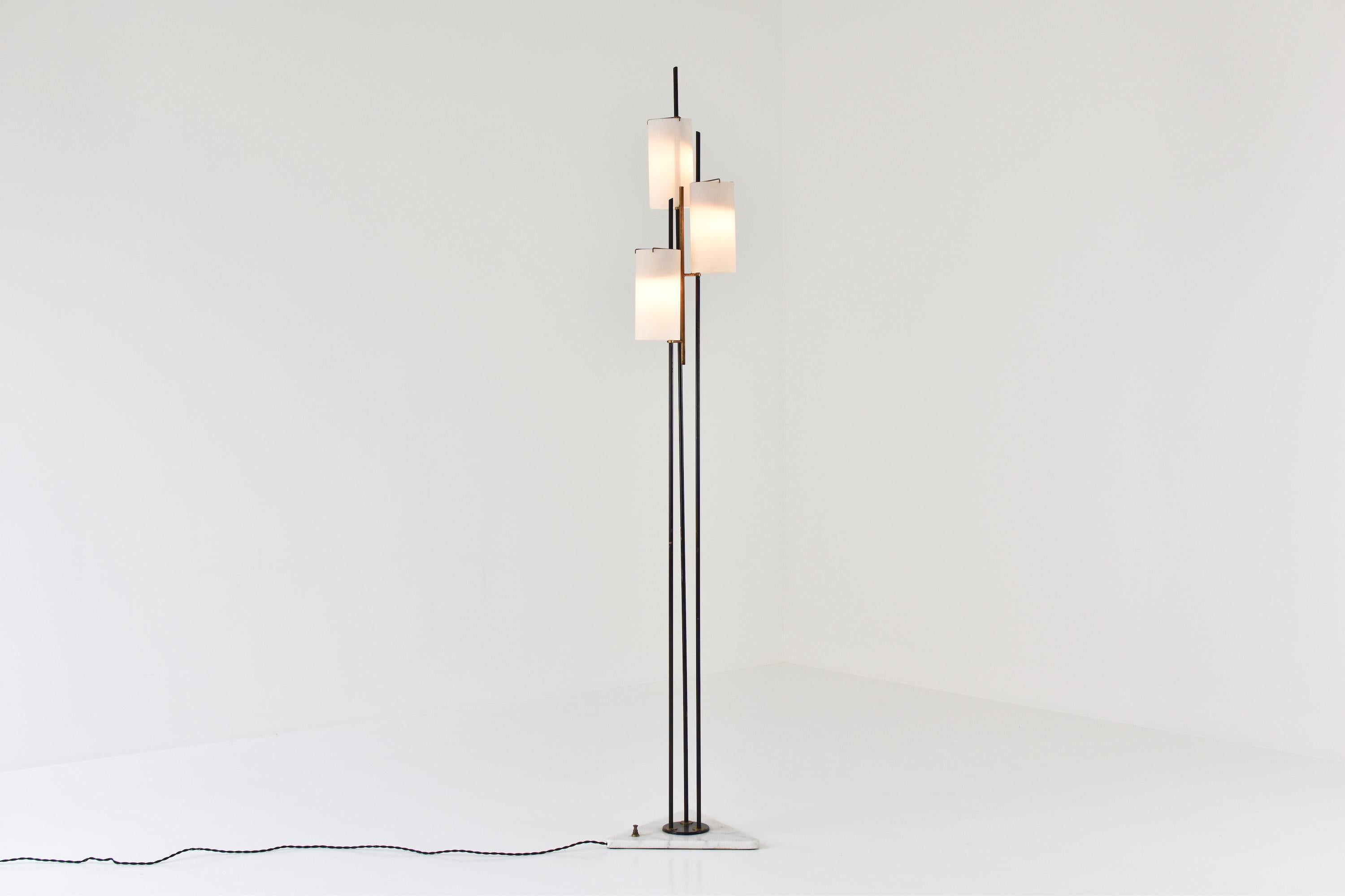 Floor lamp by Stilnovo, Italy, circa 1948. This midcentury floor lamp features a triangular marble foot, black lacquered steel and three opaline glass shades. Lovely brass suspension. All in very good original condition, newly rewired.