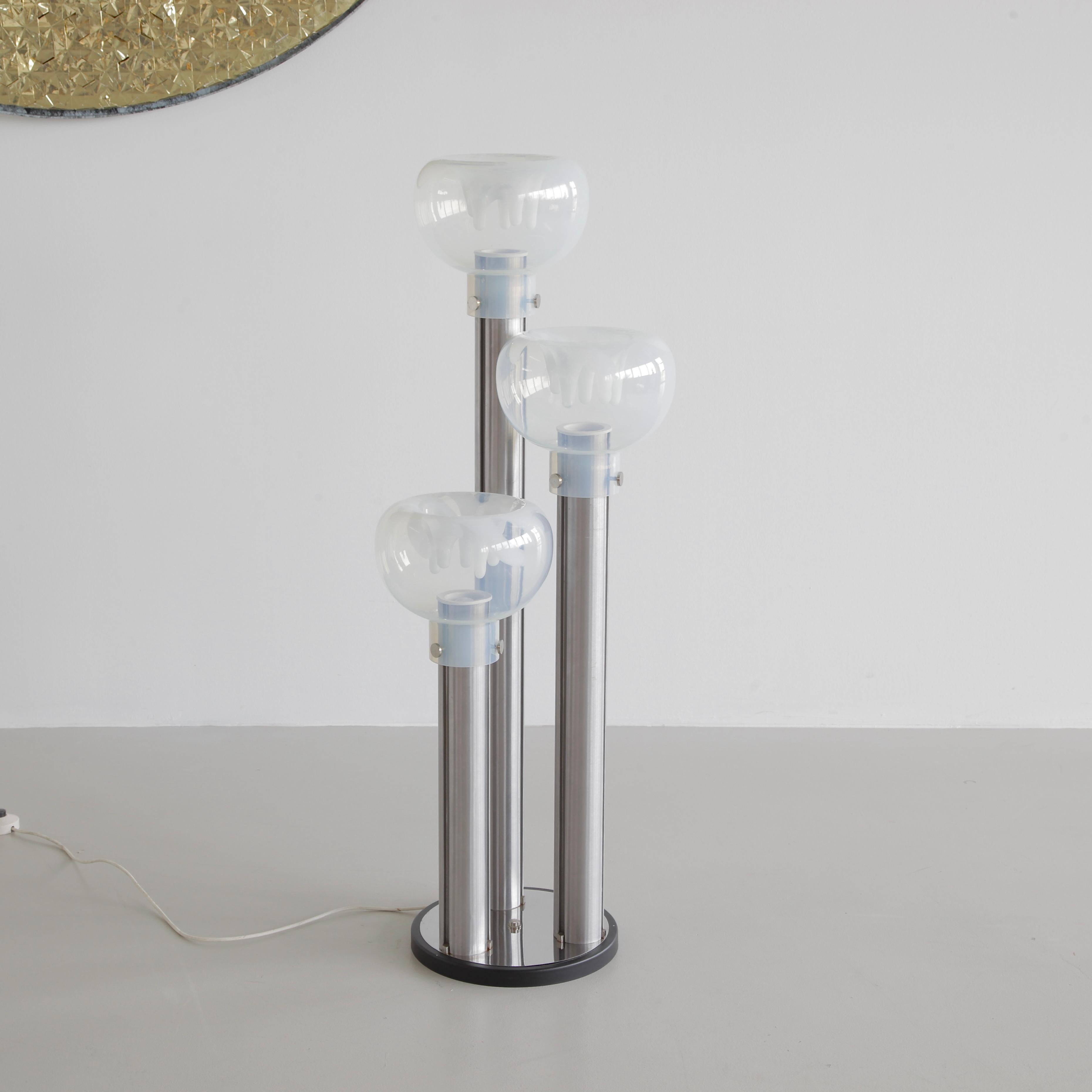 Floor lamp designed by Tony Zuccheri, Italy, VeArt, 1970s.

Standard lamp with three hand-moulded glass lampshades, organic clear and white structure. Metal base with three metal legs supporting the lampshades. Glass made in Murano.