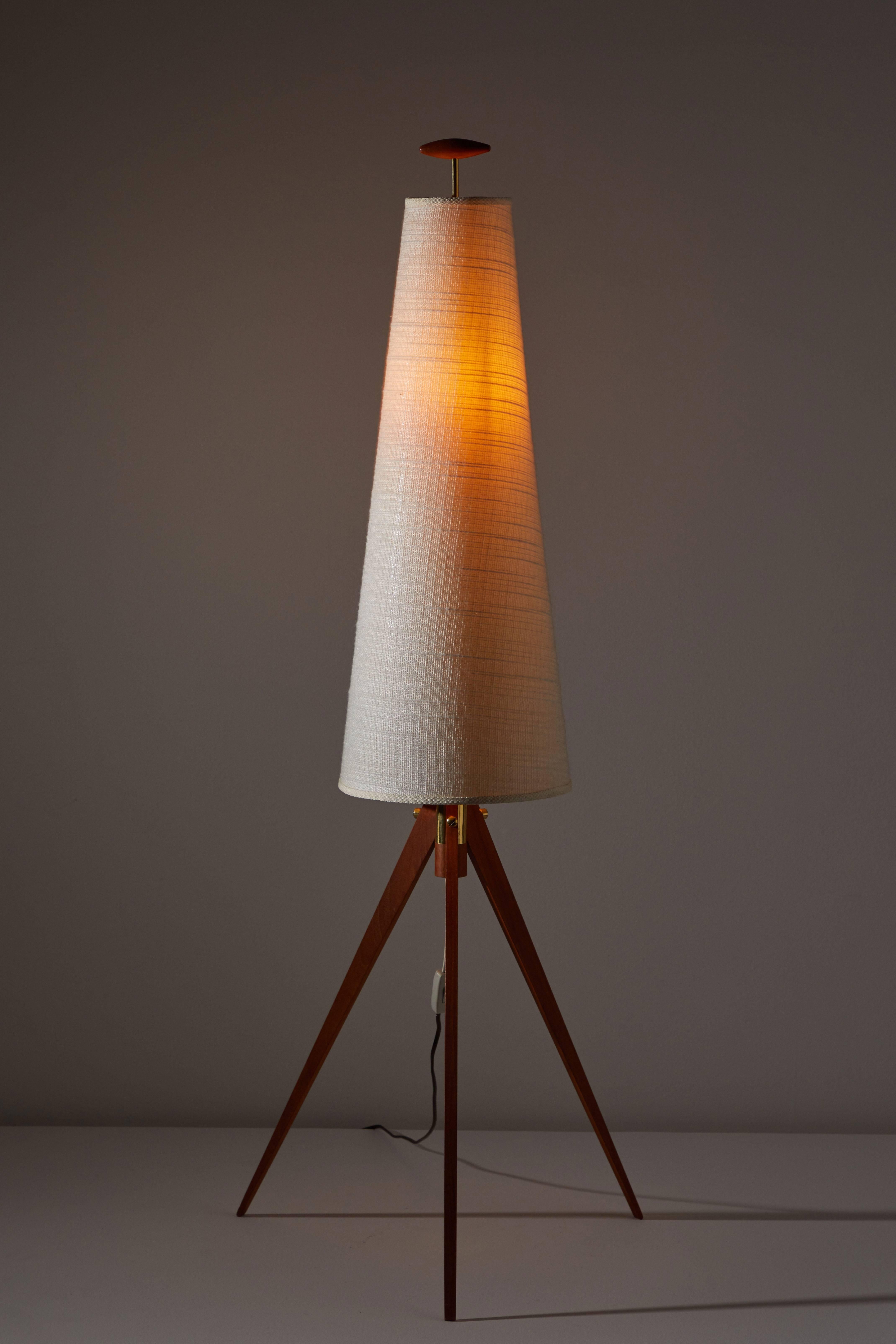 Floor lamp designed and manufactured by Tr & Co. in Norway, circa 1960s. Original linen shade. Teak base. Original wire. Retains manufacturer's stamp. Takes one Edison 60w maximum bulb.