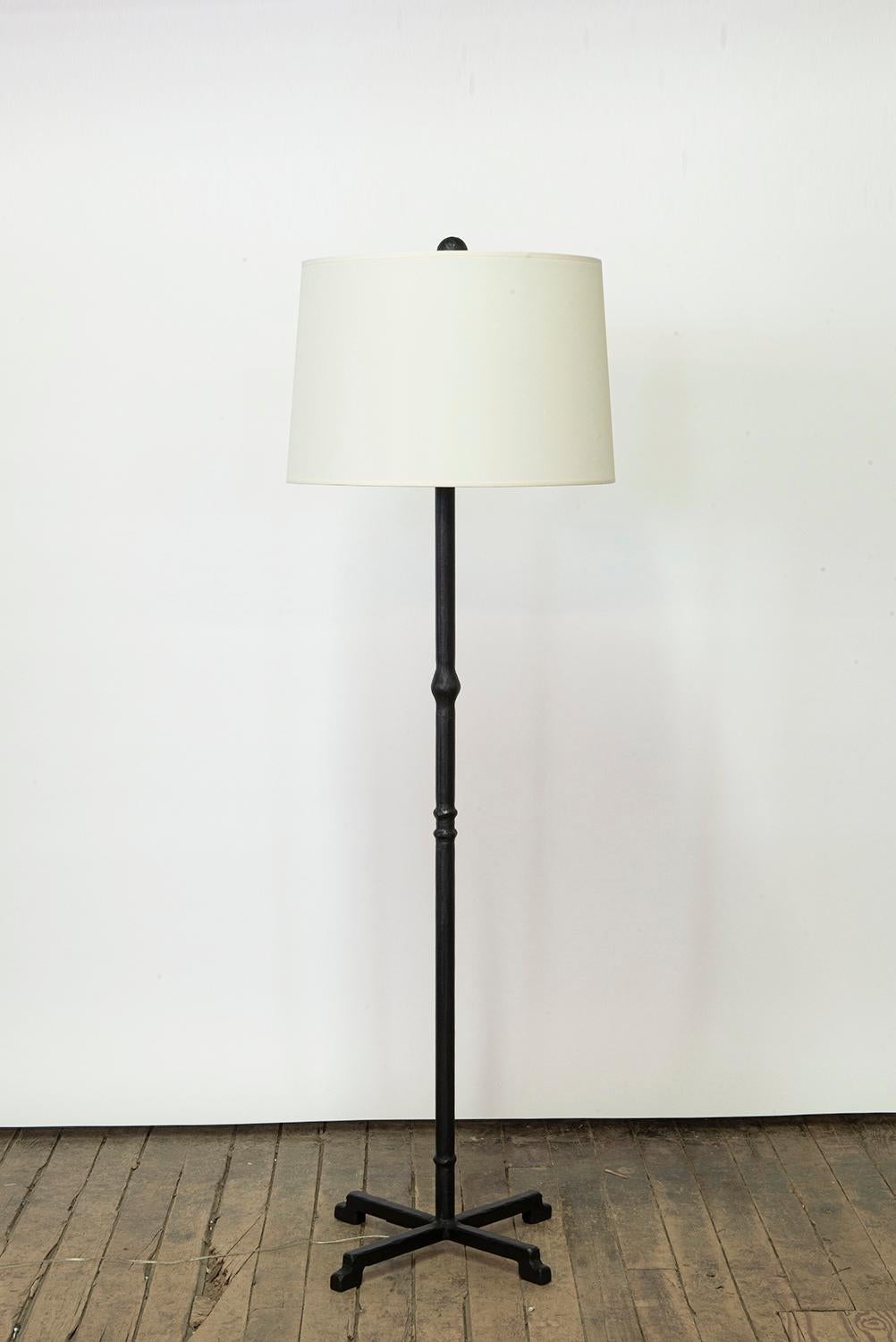 Lamp No. 5 
J.M. Szymanski
D. 2022

This special floor lamp features a linen shade and a carved steel base. A single A unique take on a classic look, this simple lamp features a custom linen shade and elegant steel embellishments. While details