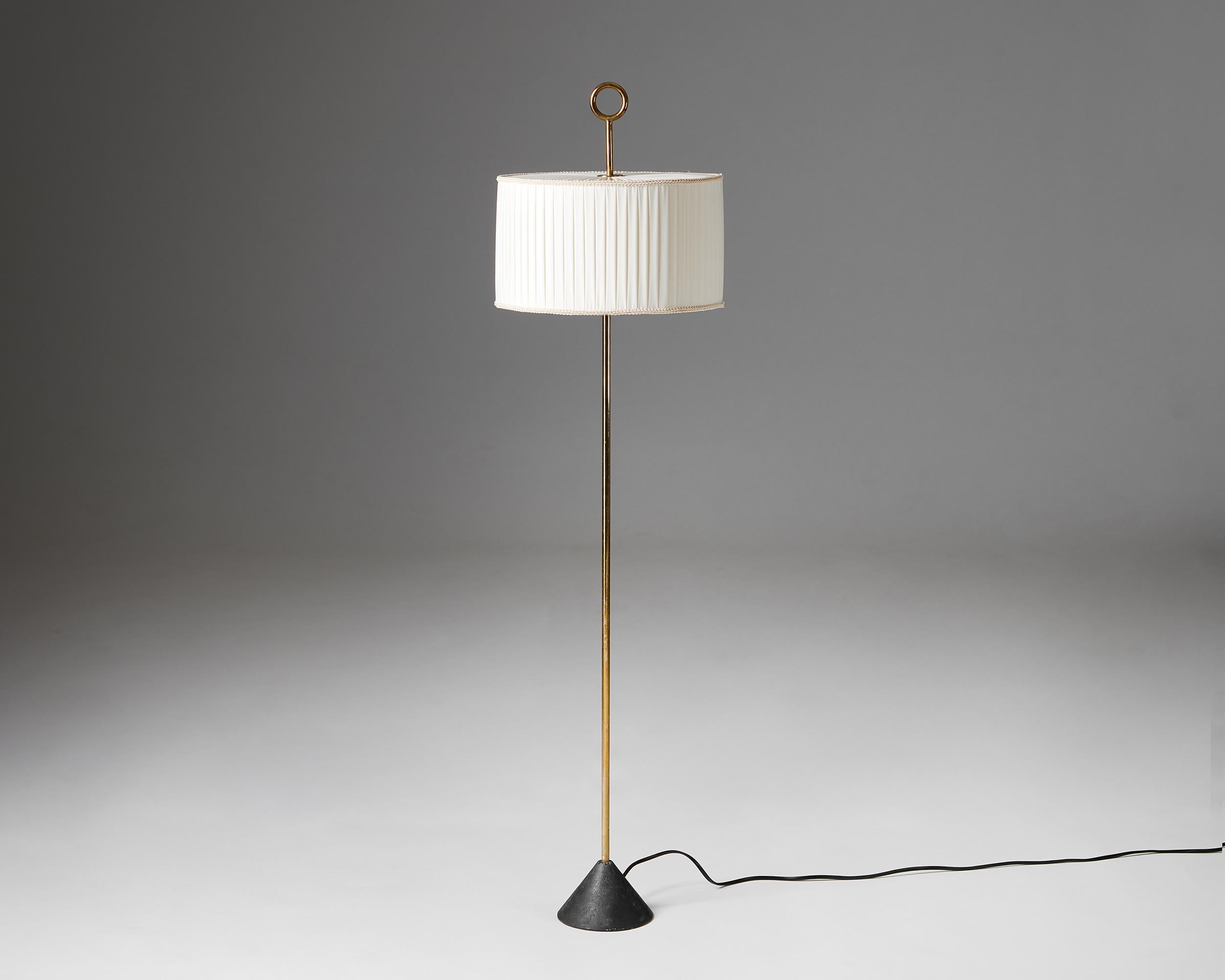 Floor lamp designed by Hans-Agne Jakobsson,
Sweden. 1960s.

Brass with fabric shade.

Active between the 1950s and 1970s—in the golden age of Scandinavian design—Swedish interior decorator and furniture designer Hans-Agne Jakobsson is best