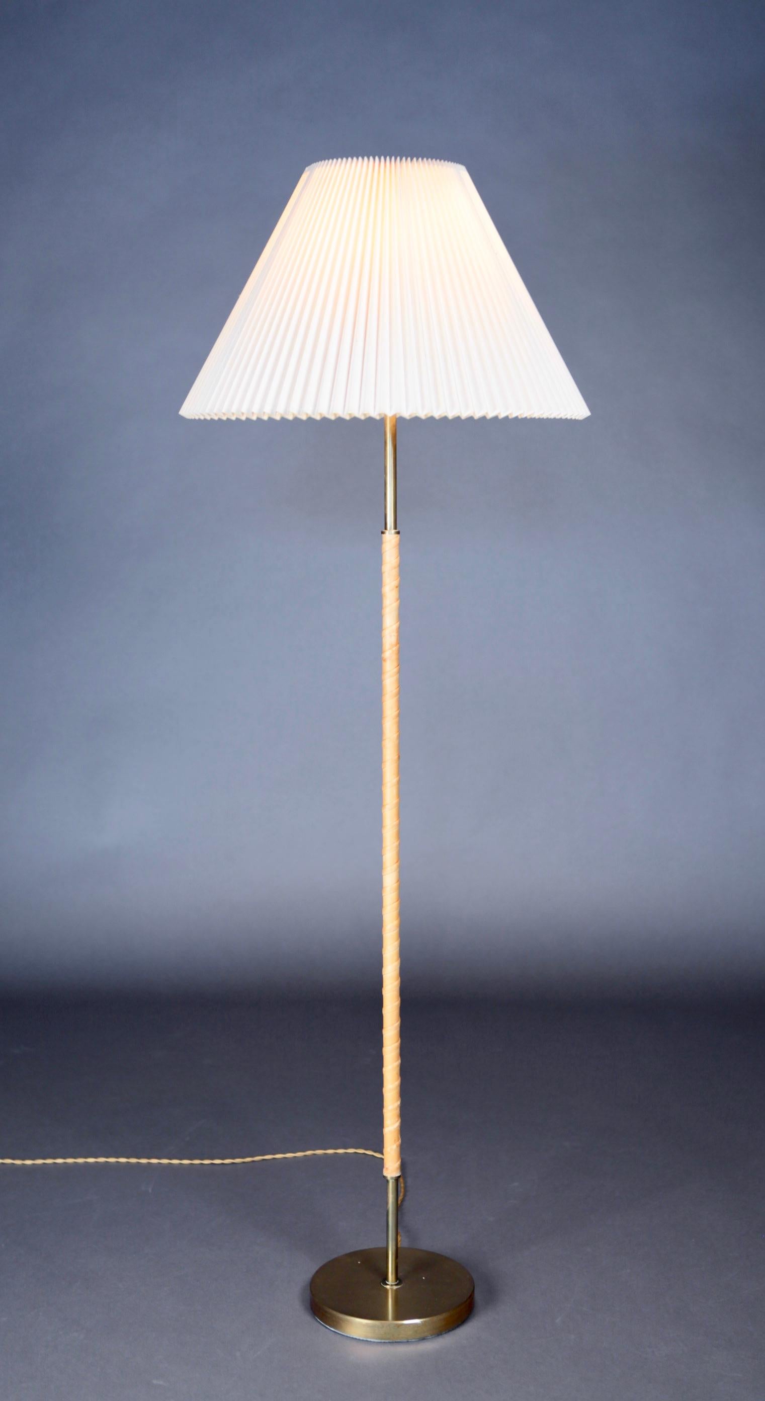Leather and brass floor lamp by Harald Elof Notini for Böhlmarks, Sweden, 1940s.
