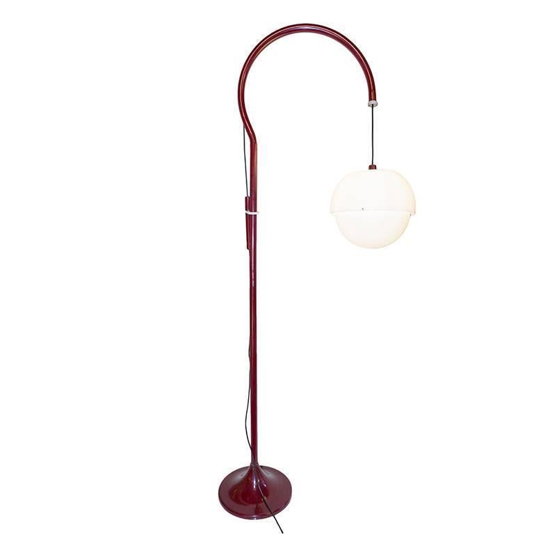 White floor lamp in lacquered metal and acrylic. Height of globe can be adjusted by pulley and counter balanced weight. The metal arm that holds the globe rotates. All original condition.  The Lamp has an up and down function. 
I am available for