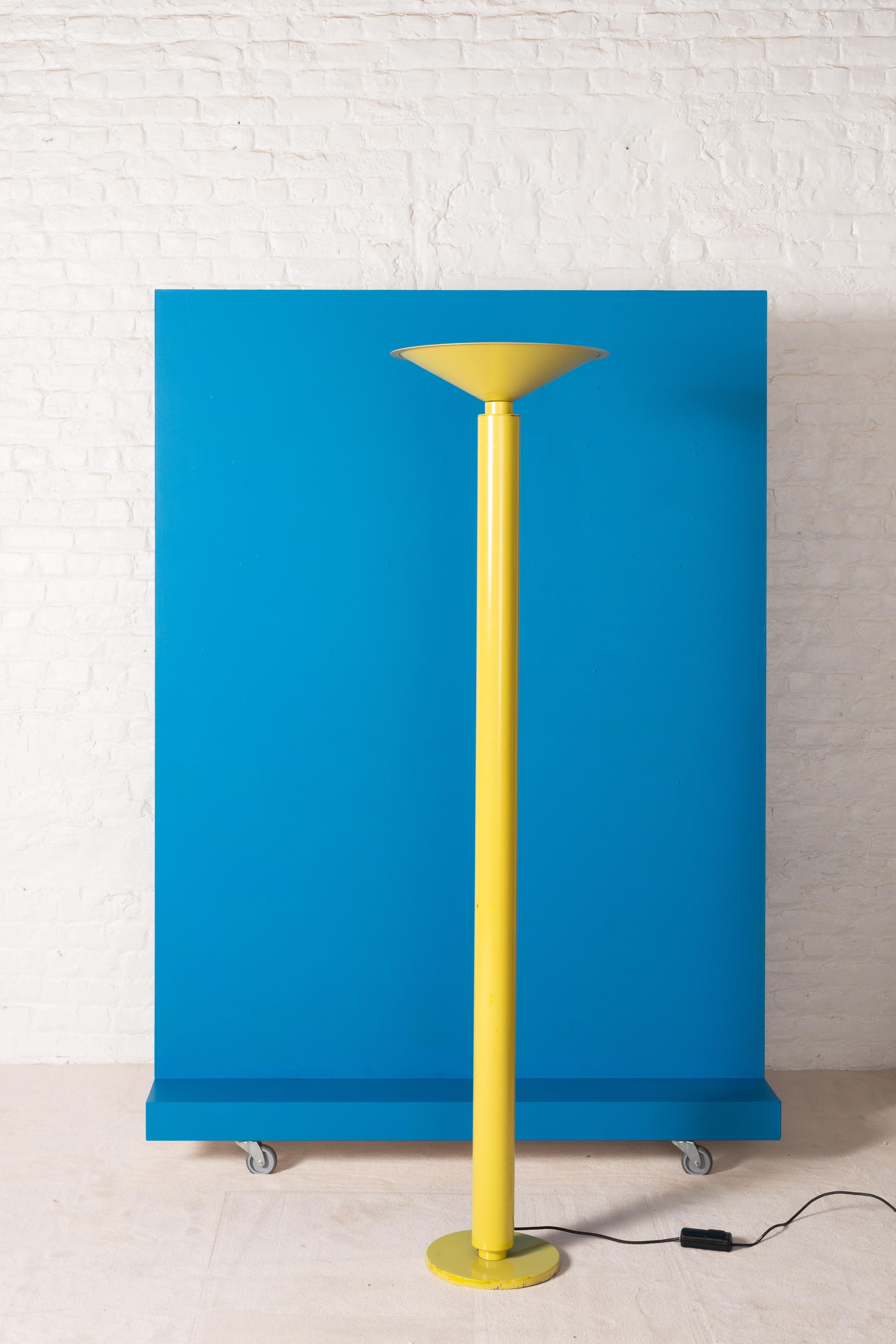 This floor lamp designed for Relco with a  flared dish shape on top and a cilindrical stem gives along with the yellow laquer guives this piece the playfull experimental image that is associated with the Italy in the 60's.