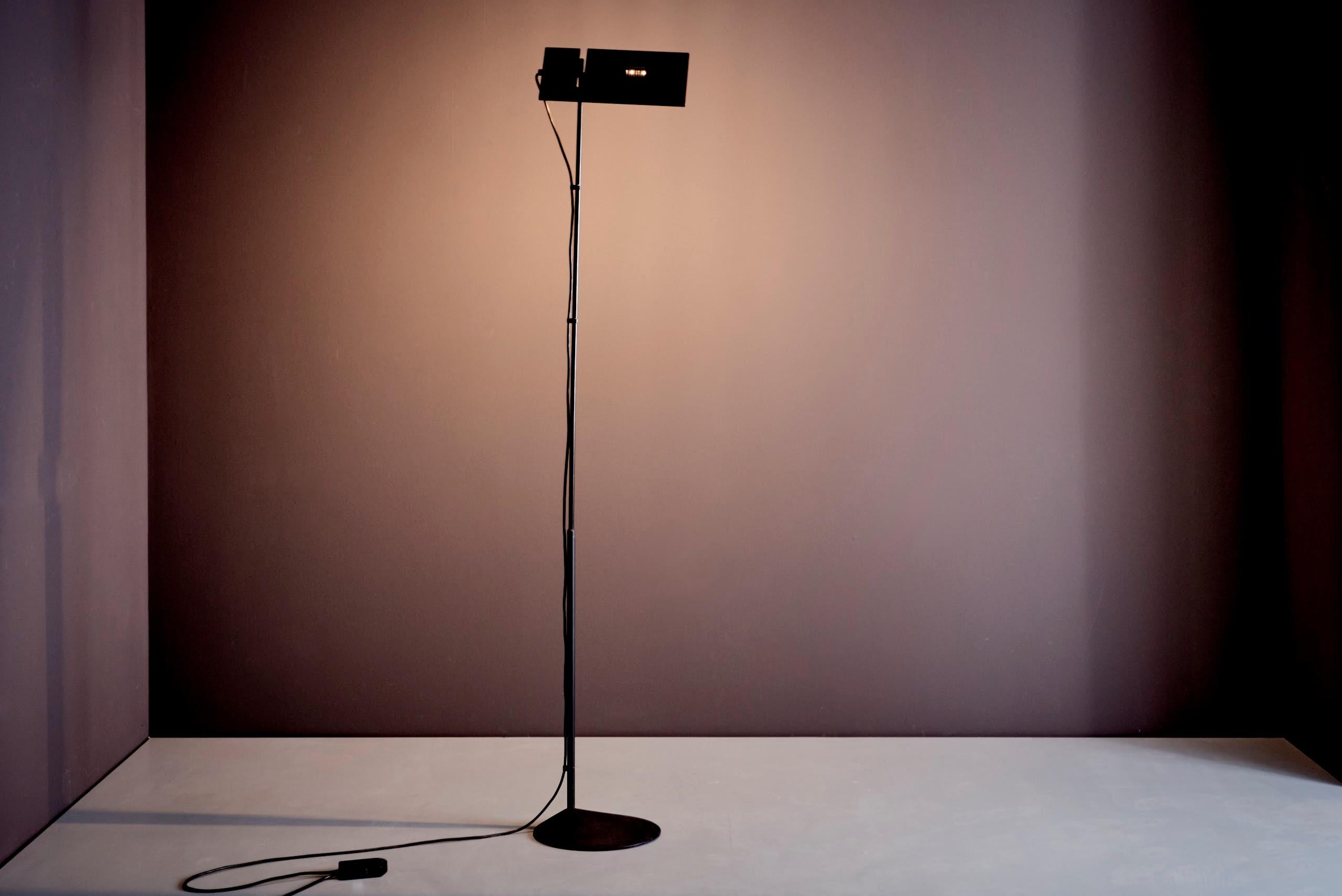 Adjustable floor lamp designed by Marco Barbaglia and Mario Colombo for PAF, Milan, 1980s. Model Duna, made of lacquered metal and aluminum with a slim, minimalist silhouette and rectangular adjustable shade. Vintage condition with minor wear