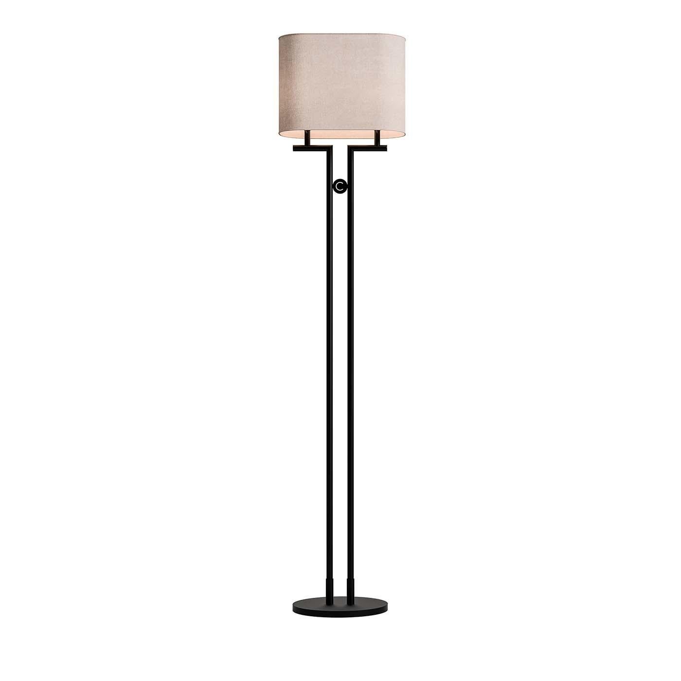 Defined by its crisp, clean lines, this stunning floor lamp brings a touch of modern style as it brightens any interior. Topped with a white fabric drum shade, the black-finished metal body comprises a round plate base and two slender rods with an