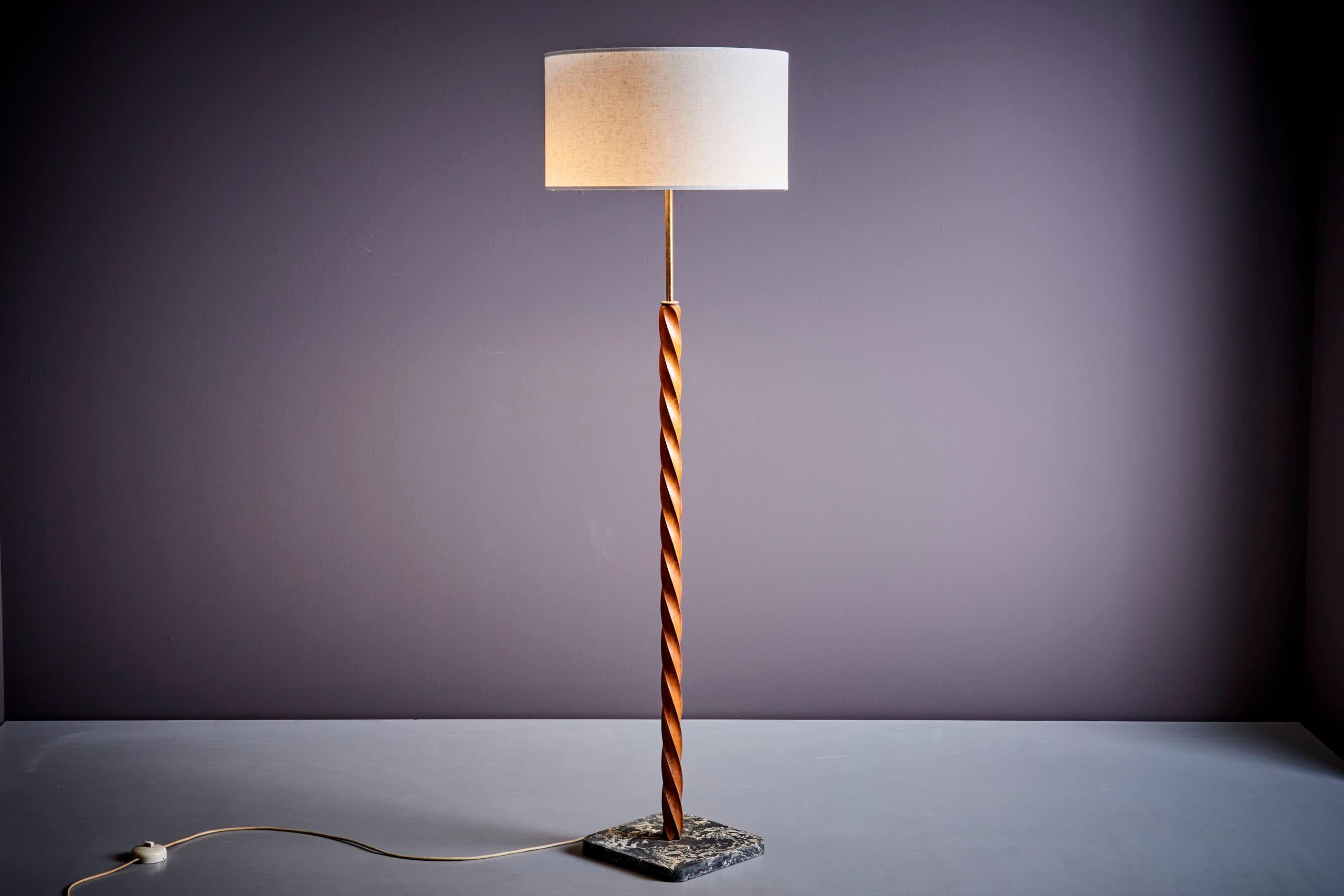 Floor Lamp, France 1940s. The measurements given apply to the lamp base without the shade. 
The base is like a concrete material. Some nice brass details and the mahogany wood just looks fantastic.
