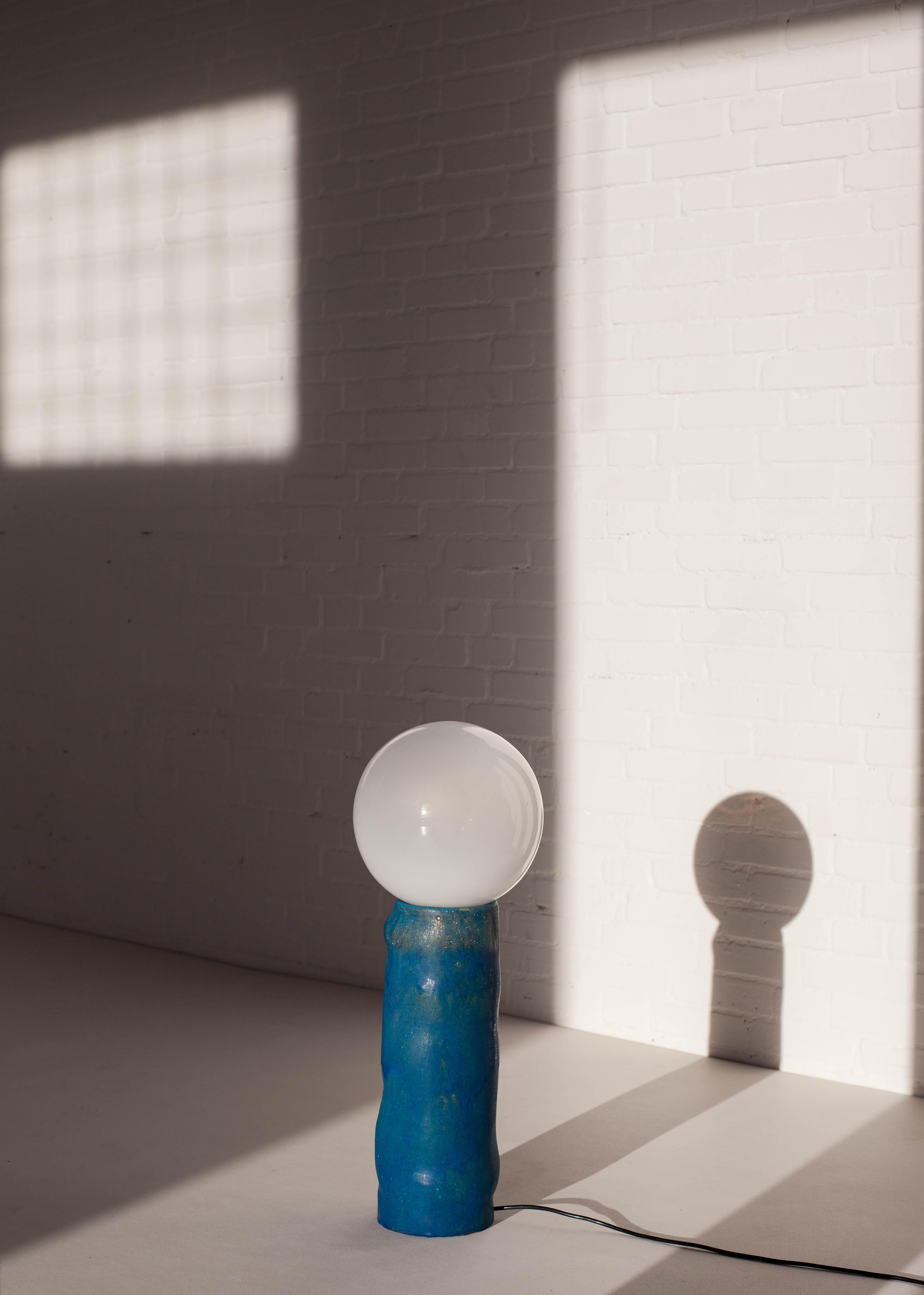 This floor lamp by the Dutch manufacturer RAAK is the odd one out among their designs produced in the 1970s. As opposed to the application of industrialised materials such as metals and plastics, this unique lamp features the use of blown glass and