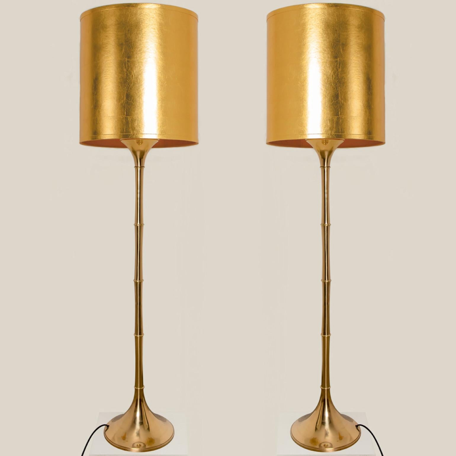 Elegant brass bamboo floor lamps Model designed by Ingo Maurer, 1968 for Design M Munich, Germany.
With new gold metal custom made lamp shades with Bronze inner shade. Made by Rene Houben. Also other lampshades available. Ask for additional