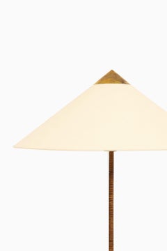 Floor Lamp in Brass and Cane by Paavo Tynell, 1950's