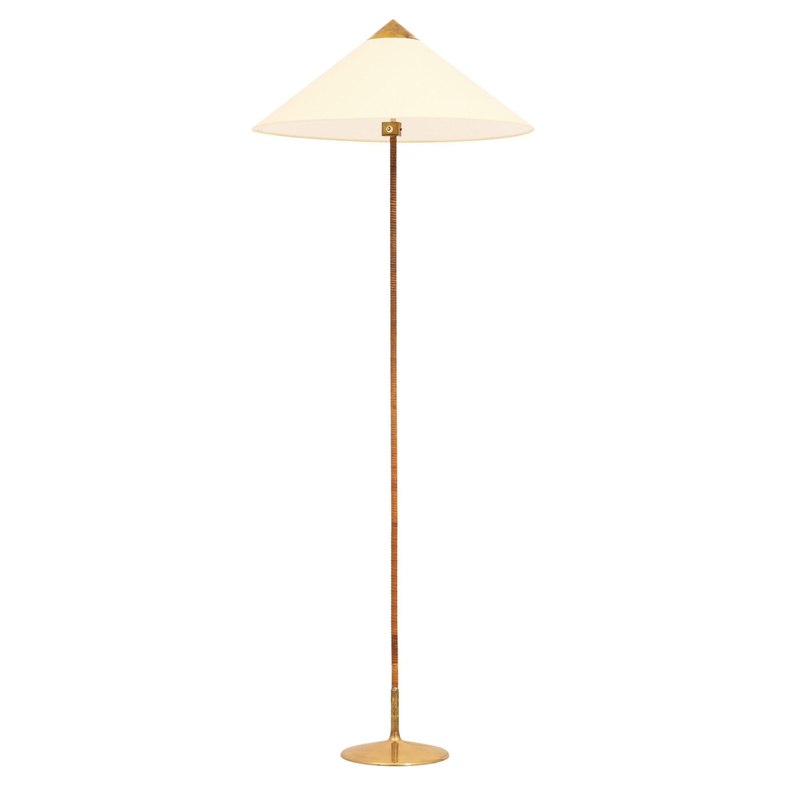 Floor Lamp in Brass and Cane by Paavo Tynell, 1950's