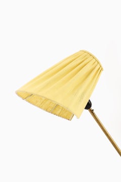 Lampada da terra in ottone e tessuto attribuita a Hans Bergström, anni '50