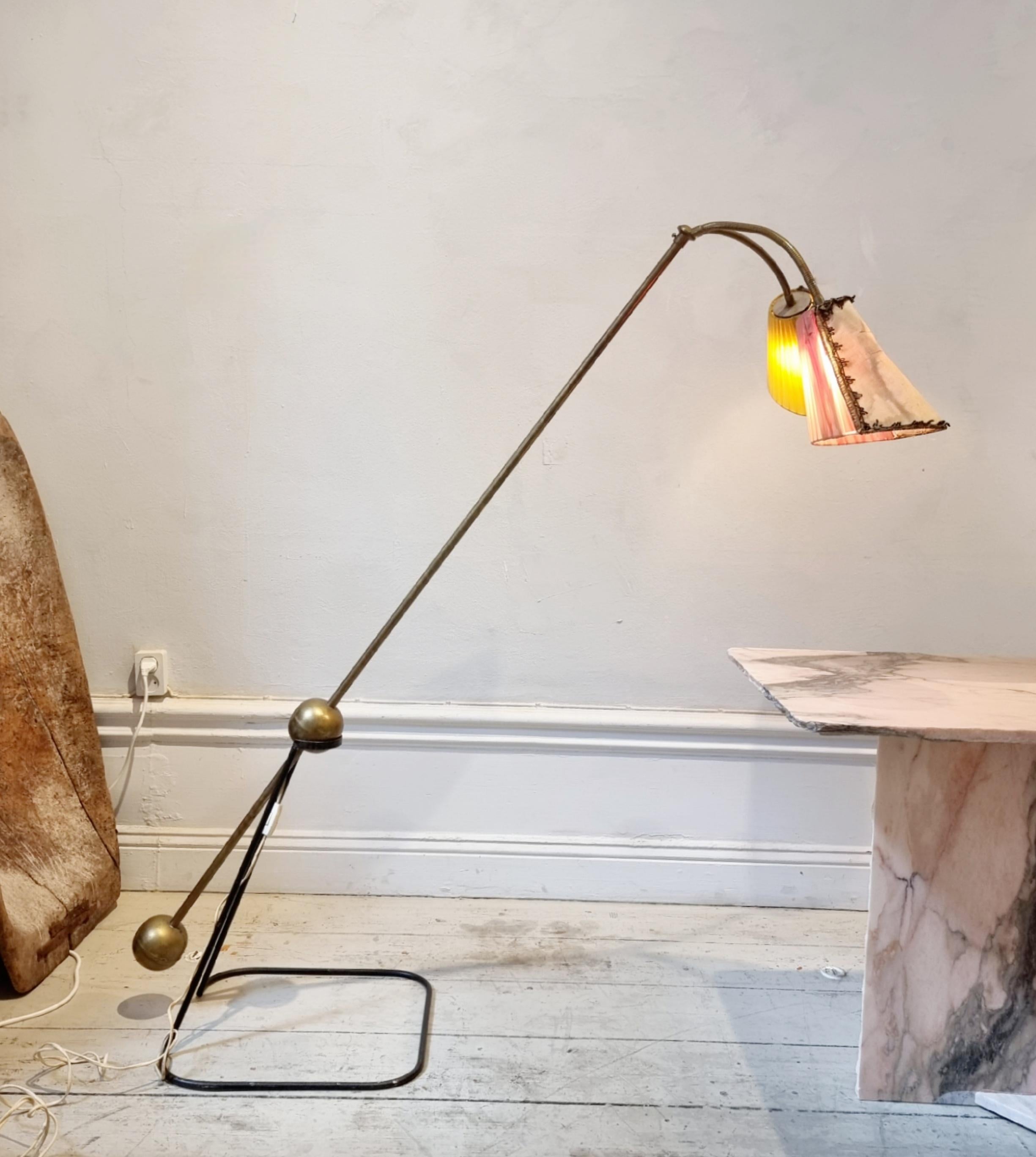 Rare floor lamp in the style of Pierre Guariche. Marked L.M. likely Luci Milano. Italian midcentury. 

With original shades, which can easily be updated with new fabric. The counterpart makes it easy to change the height and direction of the light.