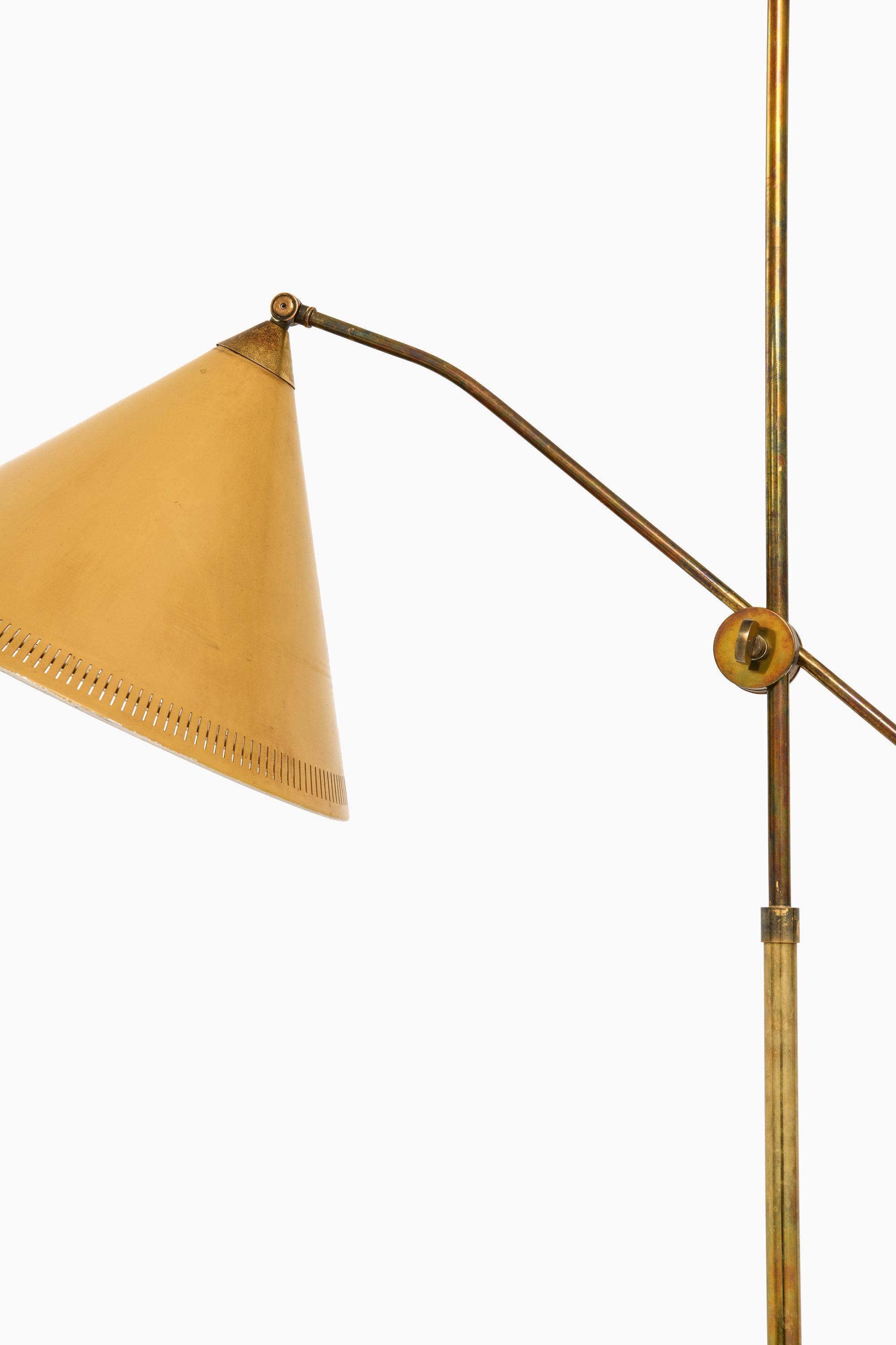 Scandinavian Modern Floor Lamp in Brass and Original Yellow Lamp Shade, 1950's For Sale
