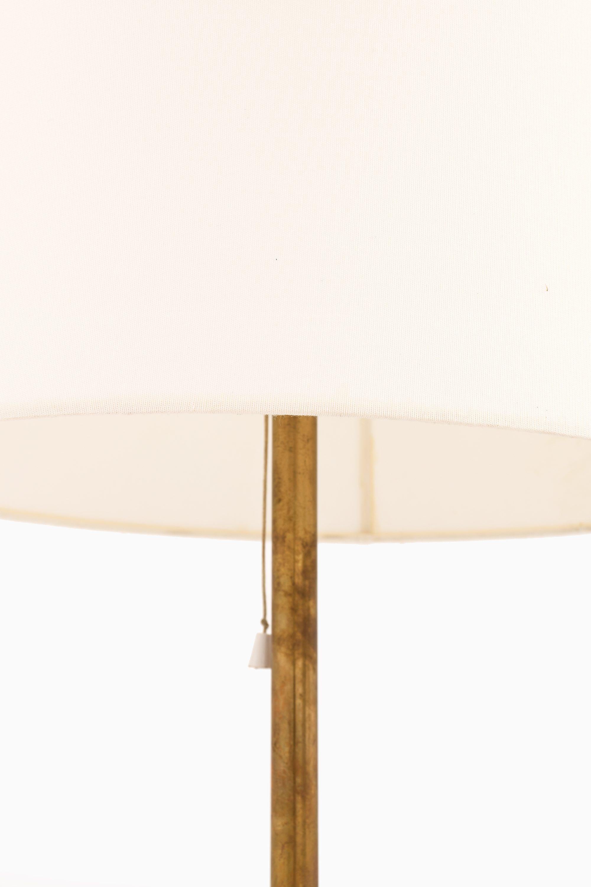 Scandinavian Modern Floor Lamp in Brass, Plastic and Fabric by Uno and Östen Kristiansson, 1960's For Sale