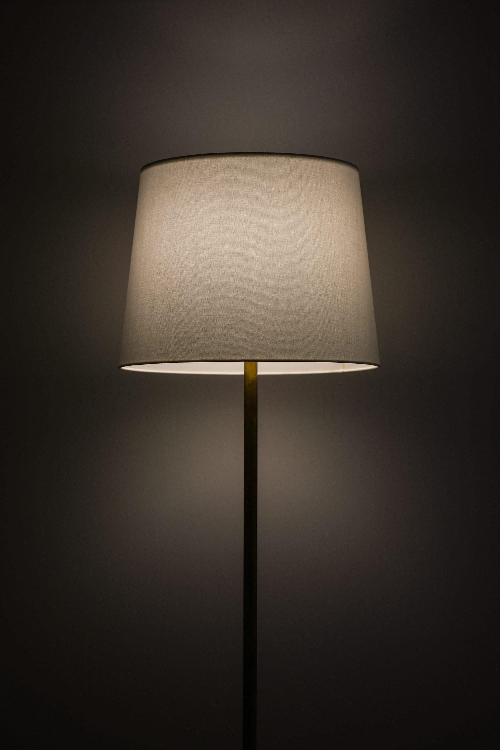 Swedish Floor Lamp in Brass, Plastic and Fabric by Uno and Östen Kristiansson, 1960's For Sale