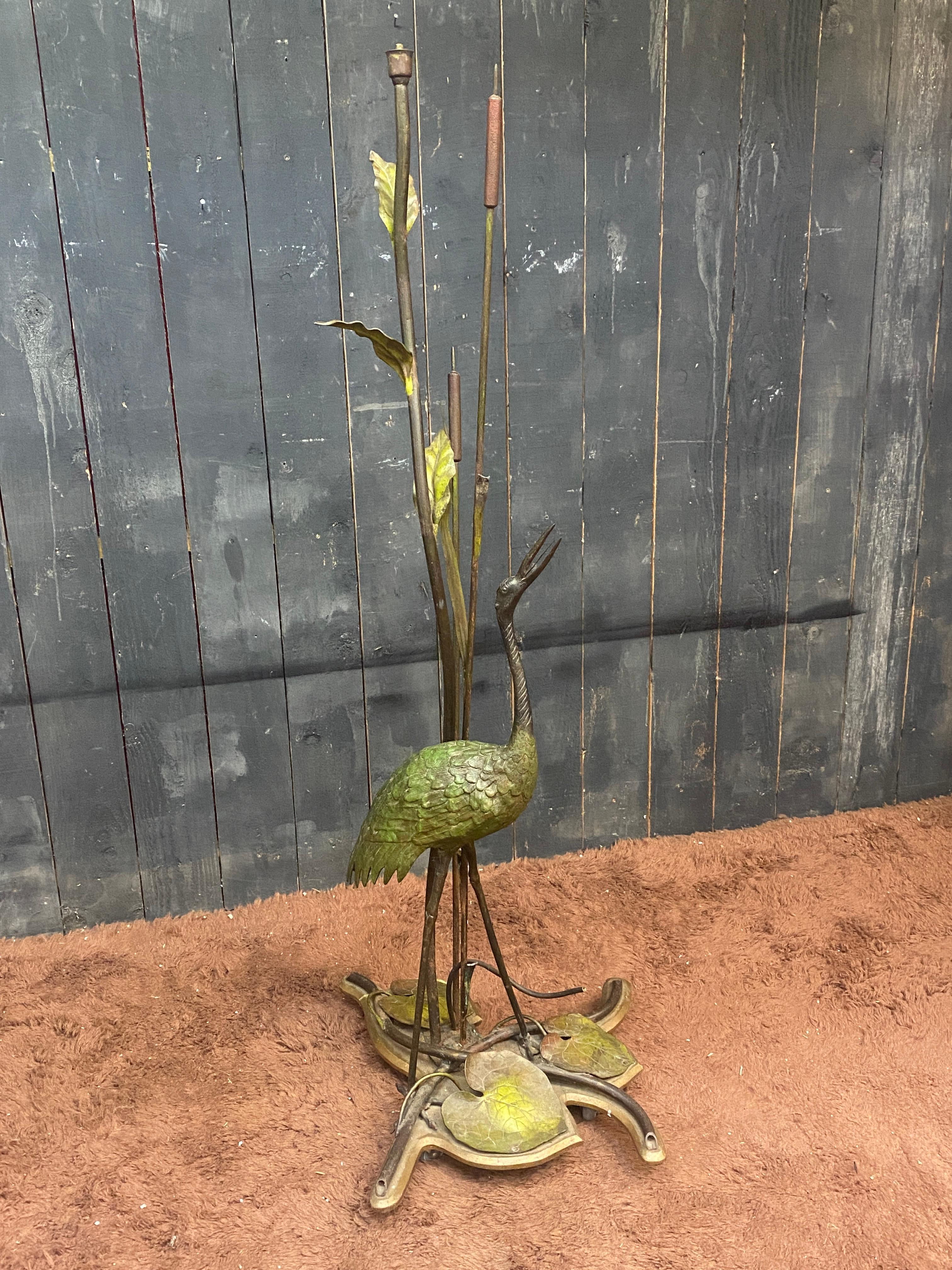 Floor lamp in bronze and painted metal decorated with a wader, circa 1900/1930
Some missing leaves
electricity to redo