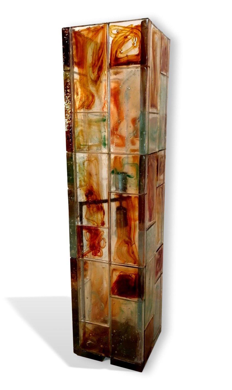 Splendid original floor lamp from the 70s, a relevant parallelepiped in thick glass (2 centimeters), variegated in the most disparate colors, very heavy, production Poliarte

Both on and off it is a piece of furniture of rare beauty, functional