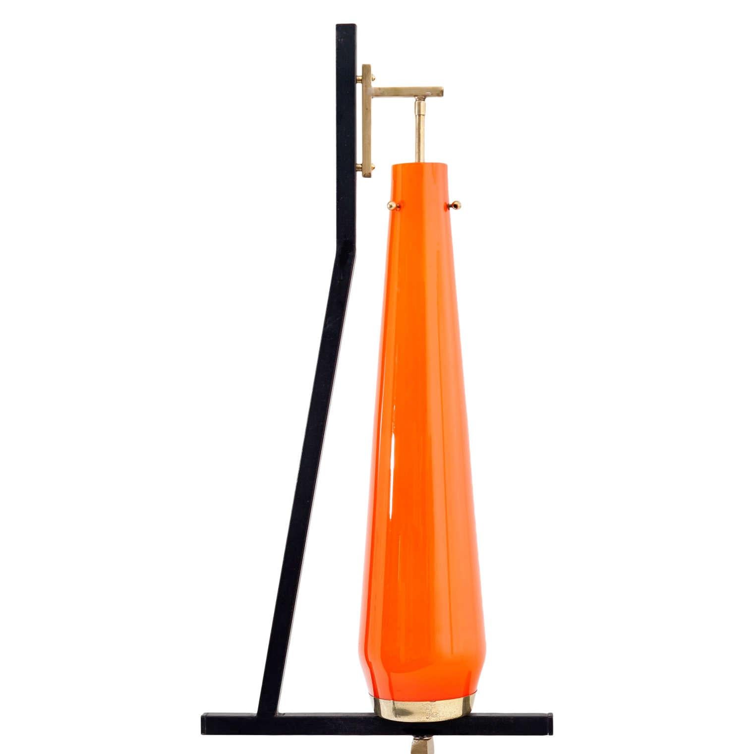 Floor lamp standing on a round marble base, with brass shaft and an orange cone-shaped glass shade. In working condition. 

For the electrification we assume no liability and no warranty.