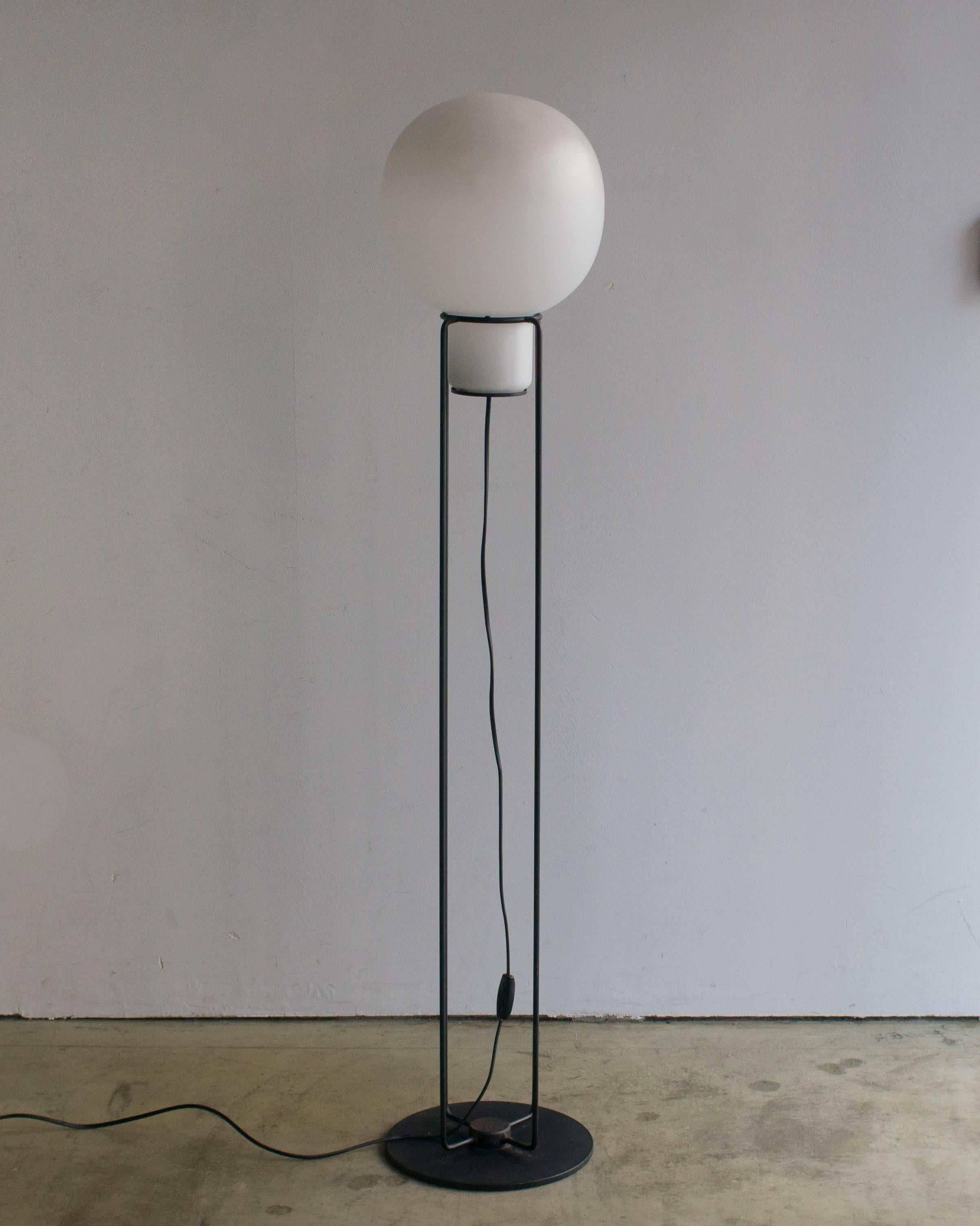 Floor lamp designed by Jo Nagahara for Yamagiwa. Made of glass and steel.
E26 bulb. White glass shade is put on four steels poles frame.