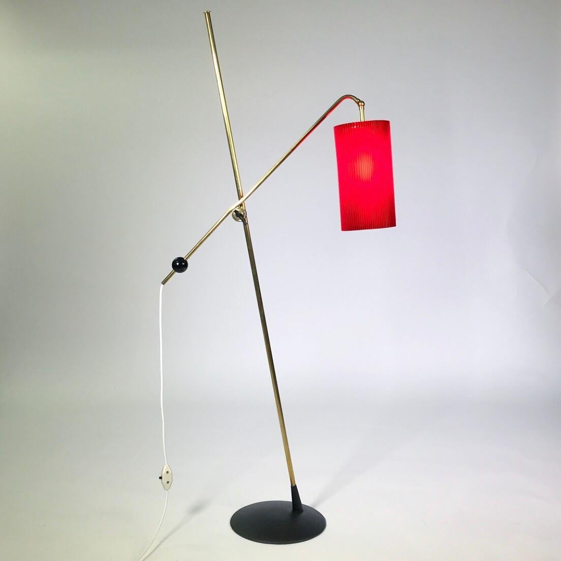 A really special brass floor lamp made by Arno Leuchten, Berlin Germany 1950s. The original manufactors label is still attached underneath the base. 

Arno Leuchten or Arno Lichthaus made high quality built lighting fixtures, however besides that,