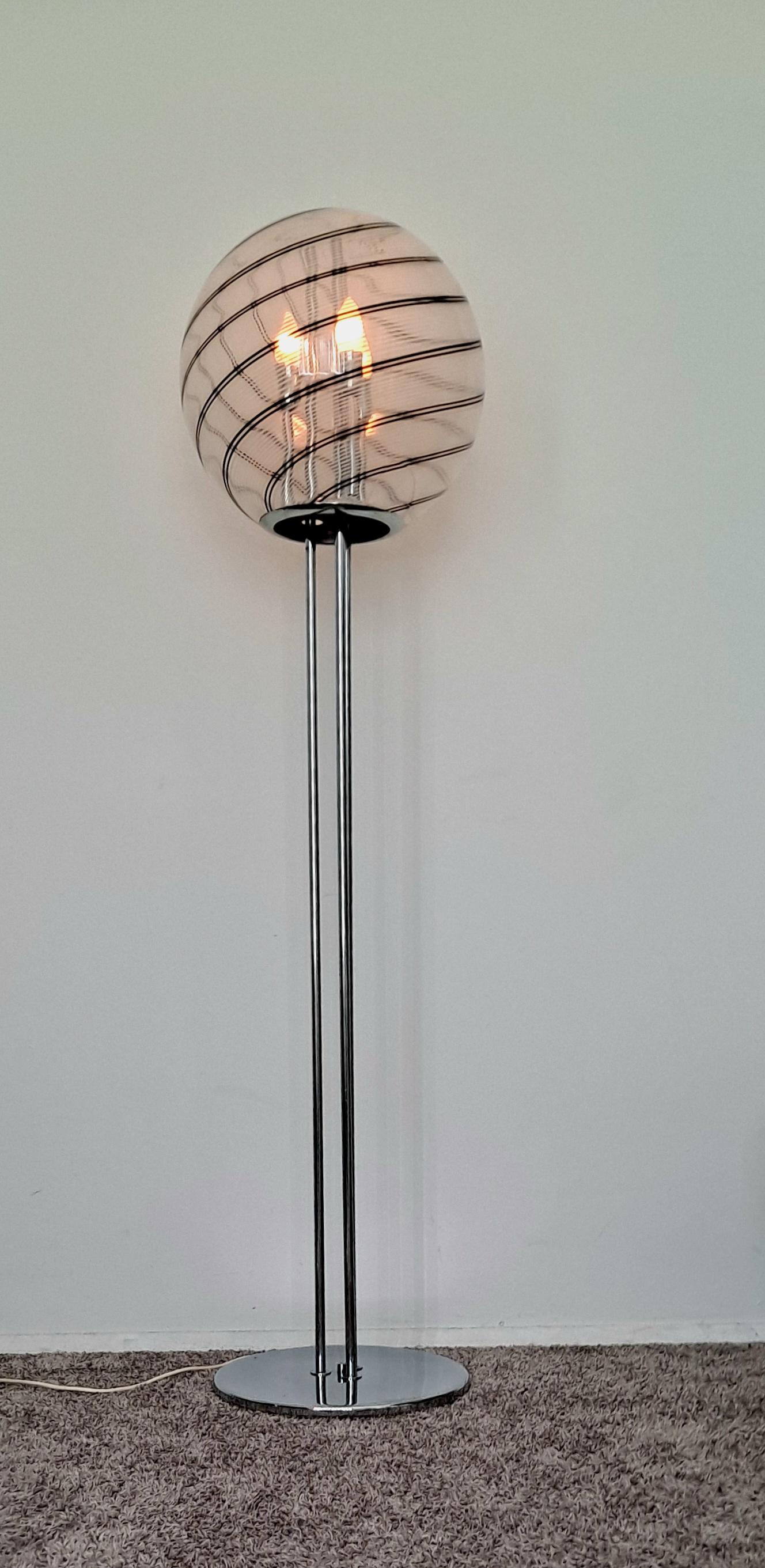 Italian floor lamp , chrome base and a large glass shade. The glass bowl got crack but still functional. I post the photo of the crack .Hand Blown glass shade  is 15.5 Diameter .On the photo is visible that the crake is on the bottom of the glass