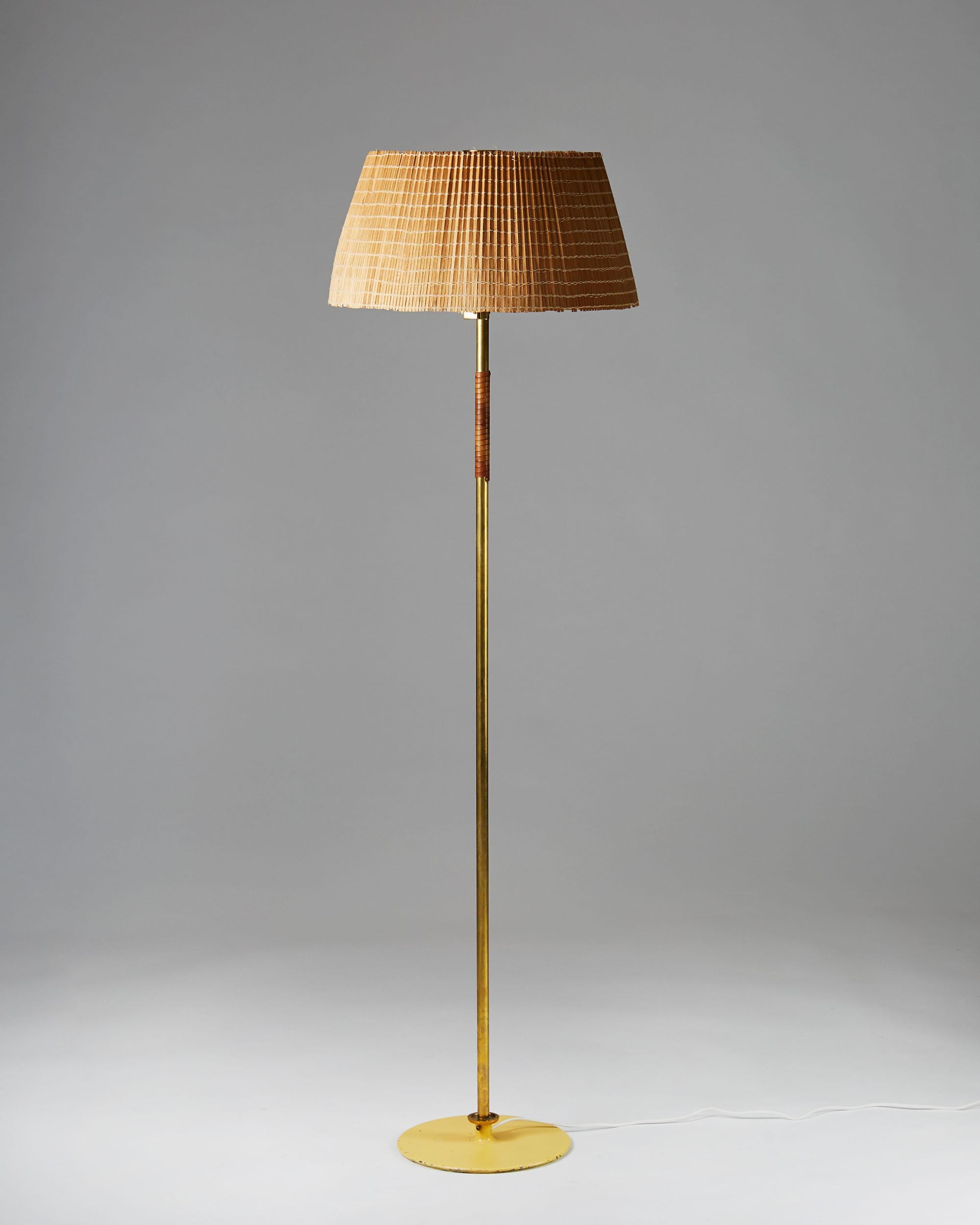 Wood, brass and leather.

Measures: H 164 cm/ 5' 5