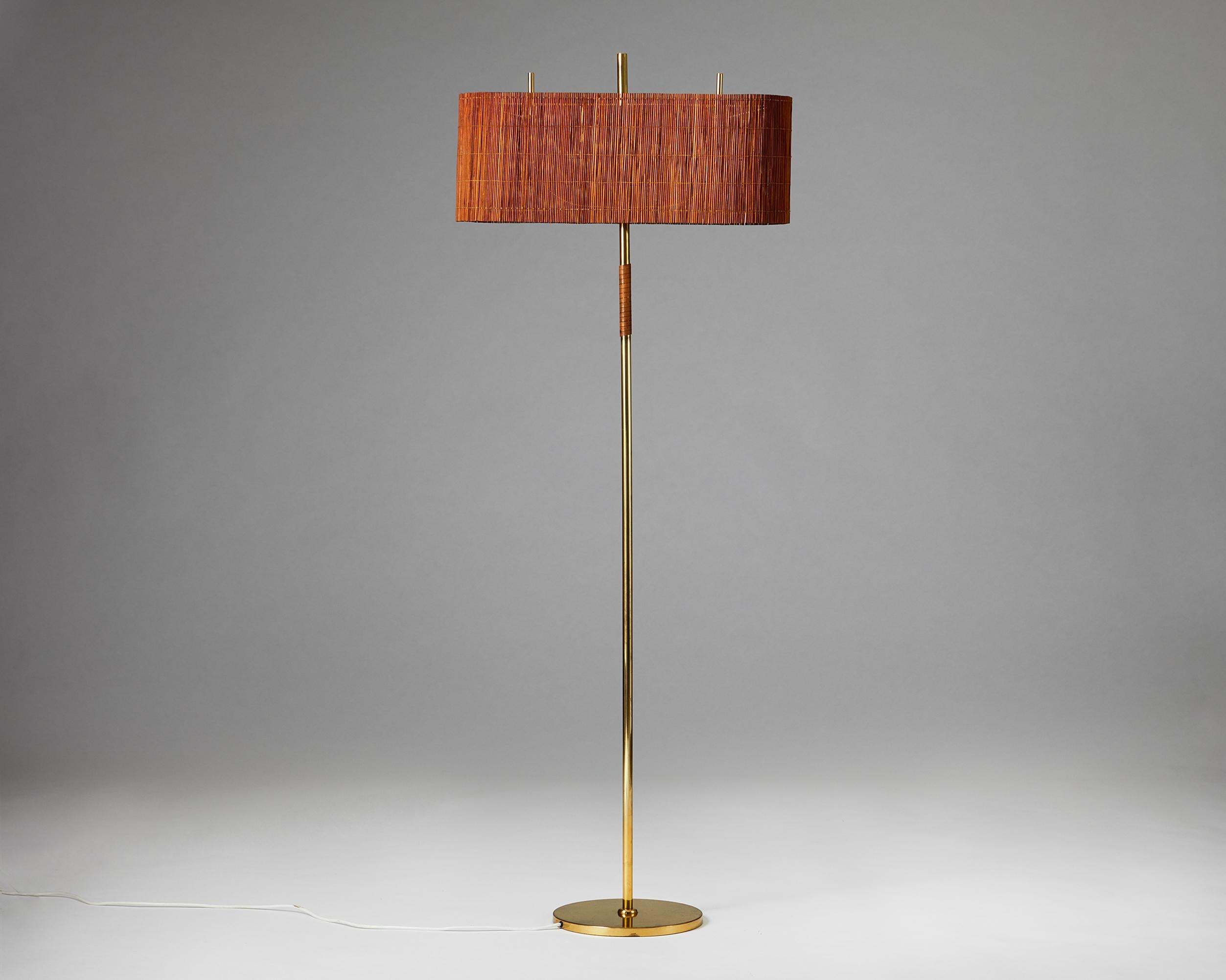 Floor lamp model 9621 designed by Paavo Tynell for Taito Oy,
Finland, 1940s.

Brass, slatted wood shade, leather.

Stamped 9621.

From a private Finnish collection.

Paavo Tynell is one of the most important 20th-century lighting designers. He was a