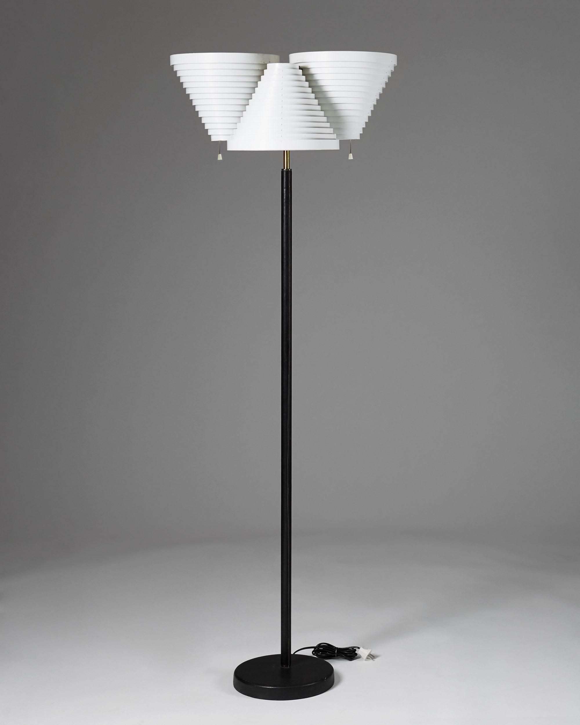 Floor lamp model A809 designed by Alvar Aalto for Valaistustyö,
Finland. 1959.

Lacquered steel, brass and leather.

Dimensions:
H: 170 cm/ 5' 7 1/4''
W: 60 cm/ 2'
D: 40 cm/ 15 3/4''

Alvar Aalto was a Finnish architect and designer. His work