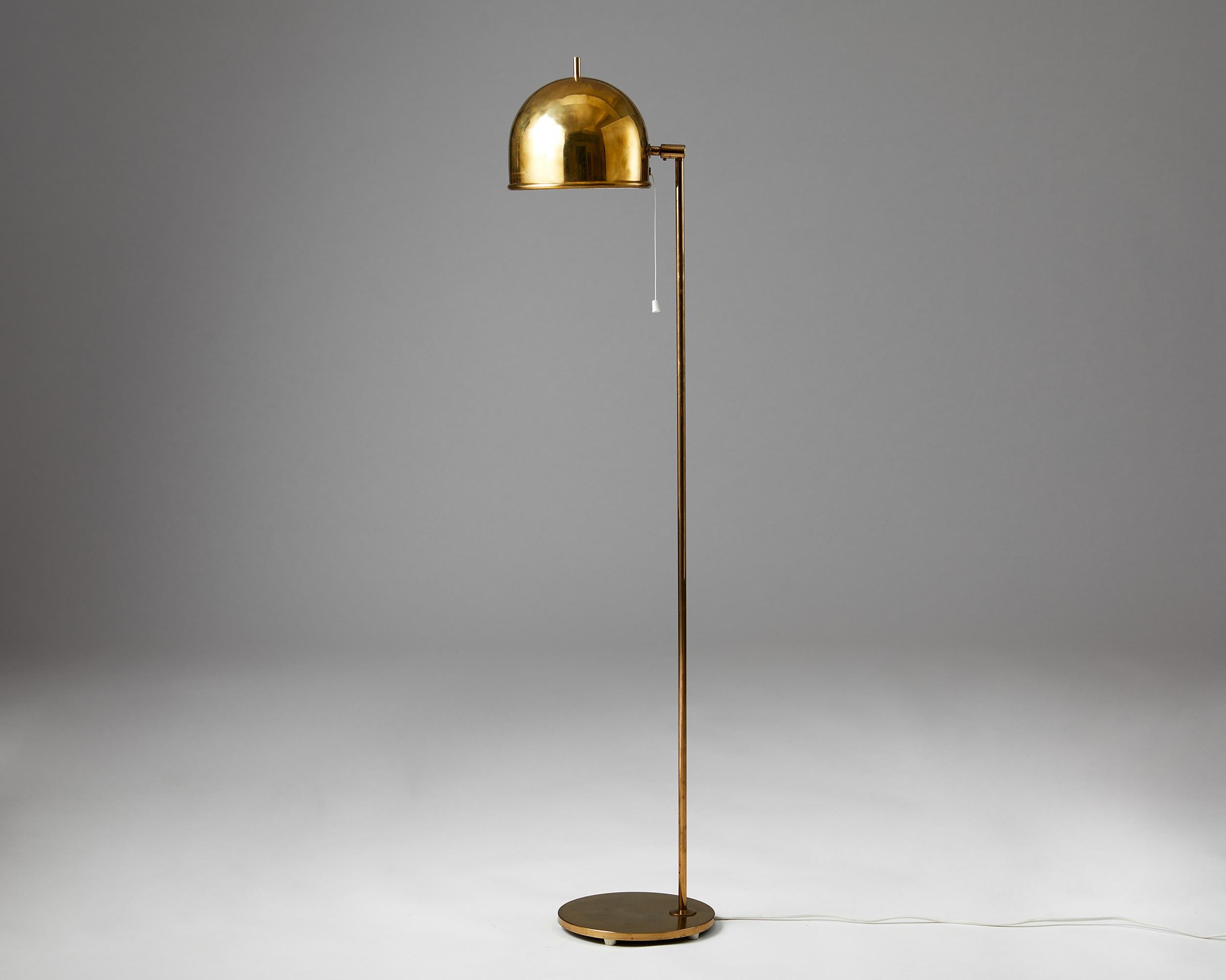 Floor lamp model G-075 designed by Eje Ahlgren for Bergboms,
Sweden. 1960s.
Brass.

This floor lamp with fully adjustable shade was manufactured in brass by Bergboms and designed by Eje Ahlgren. The protruding brass rod at the top of the shade