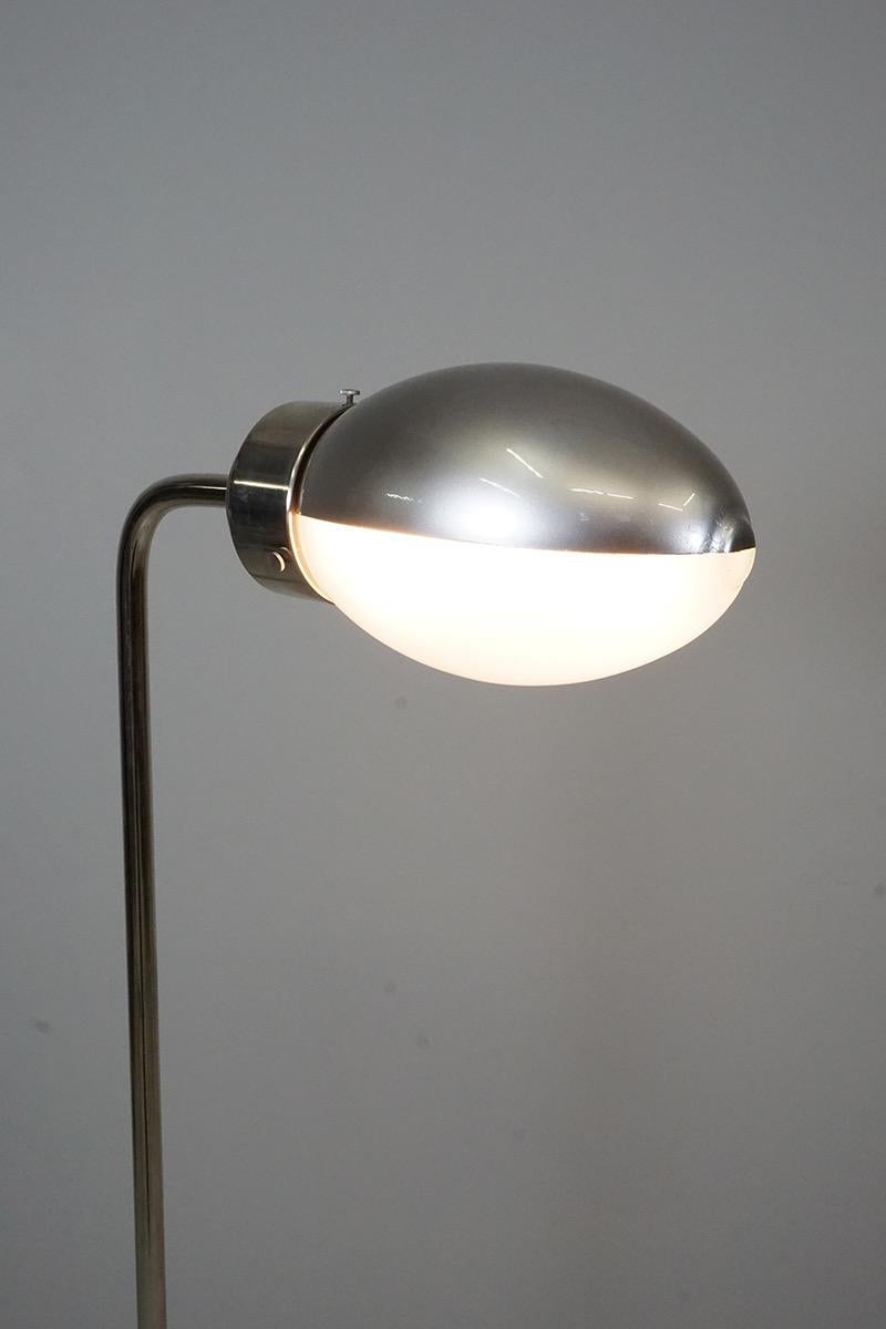 Floor lamp model no. 1007 by Franca Helg/Franco Albini 1962, Arteluce, Italy. 
The construction is chromed brass, the reflector is movable and the lamps glass is satined and lacquered. 



  