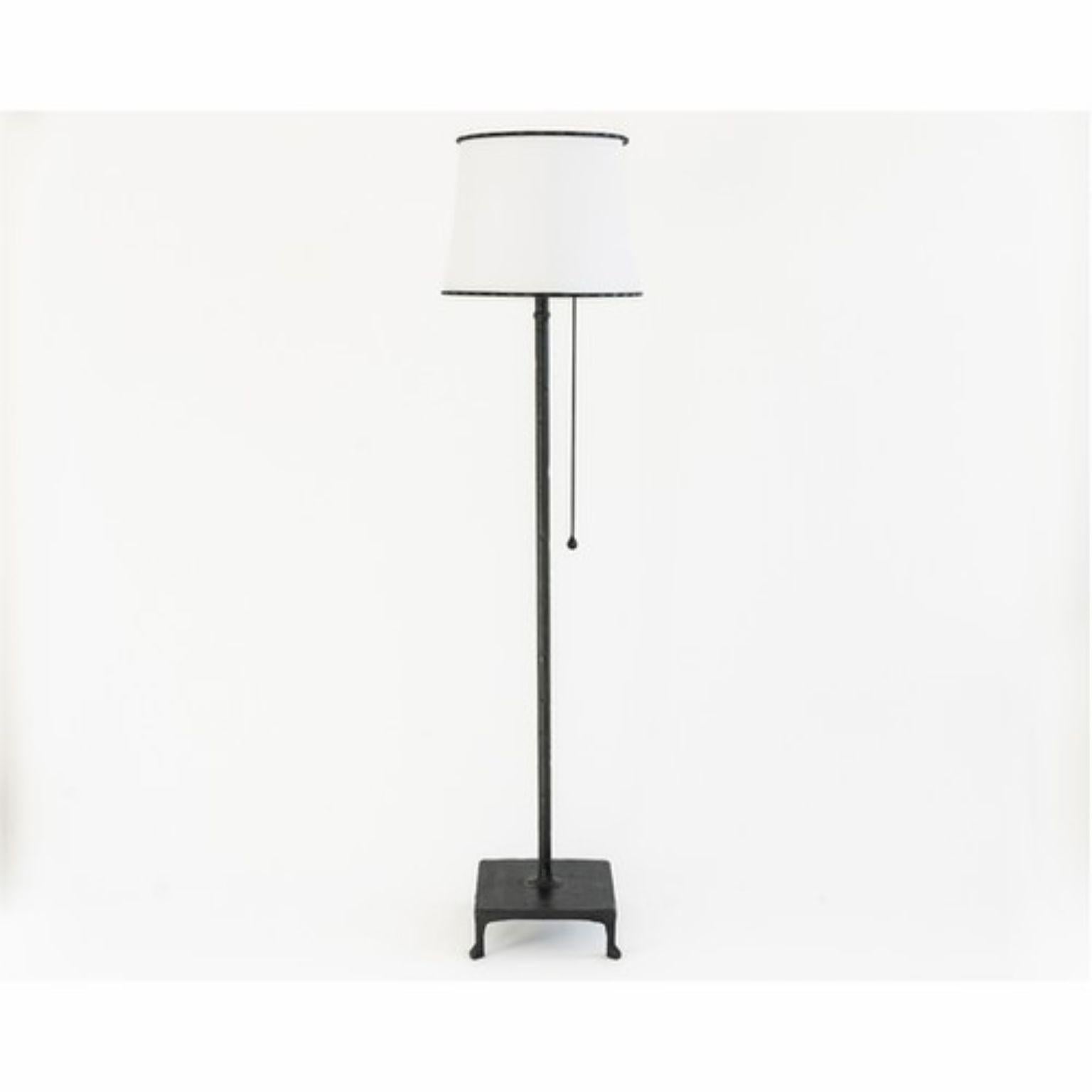 Floor lamp no. 1 by JM Szymanski
Materials: Blackened steel, waxed finish, parchment shade
Dimensions: Square base 33 x W 45.7 x H 185 cm  
 
A simple hand carved steel floor lamp with a parchment shade.

Jake Szymanski lives and designs in