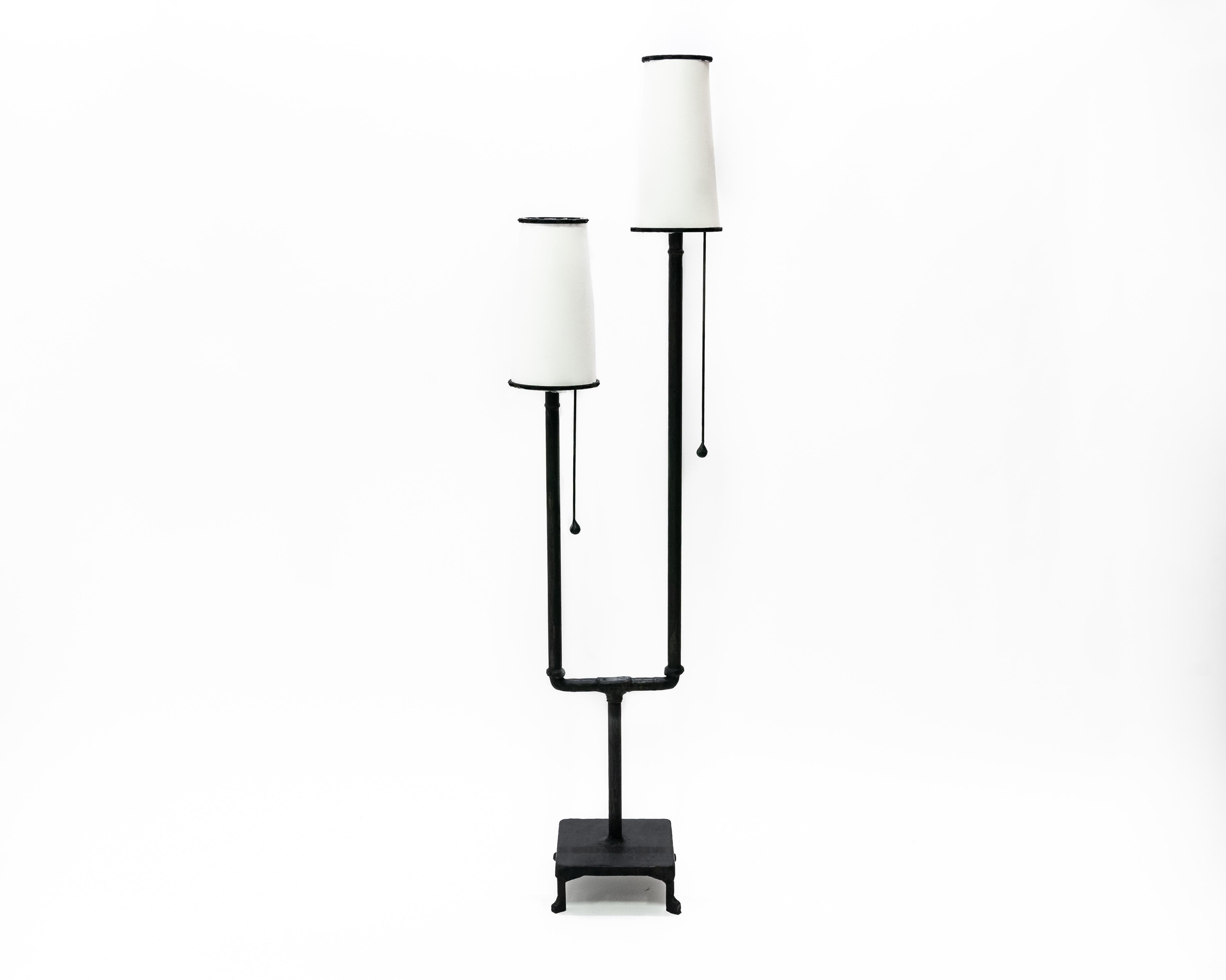 Floor Lamp No. 2 by JM Szymanski
Materials: Blackened steel, waxed finish, parchment shade
Dimensions: square base 28 x W 15.3 x H 190.5 cm 

A unique floor lamp with dual lamp shades brings depth to any room it’s in.

Jake Szymanski lives and