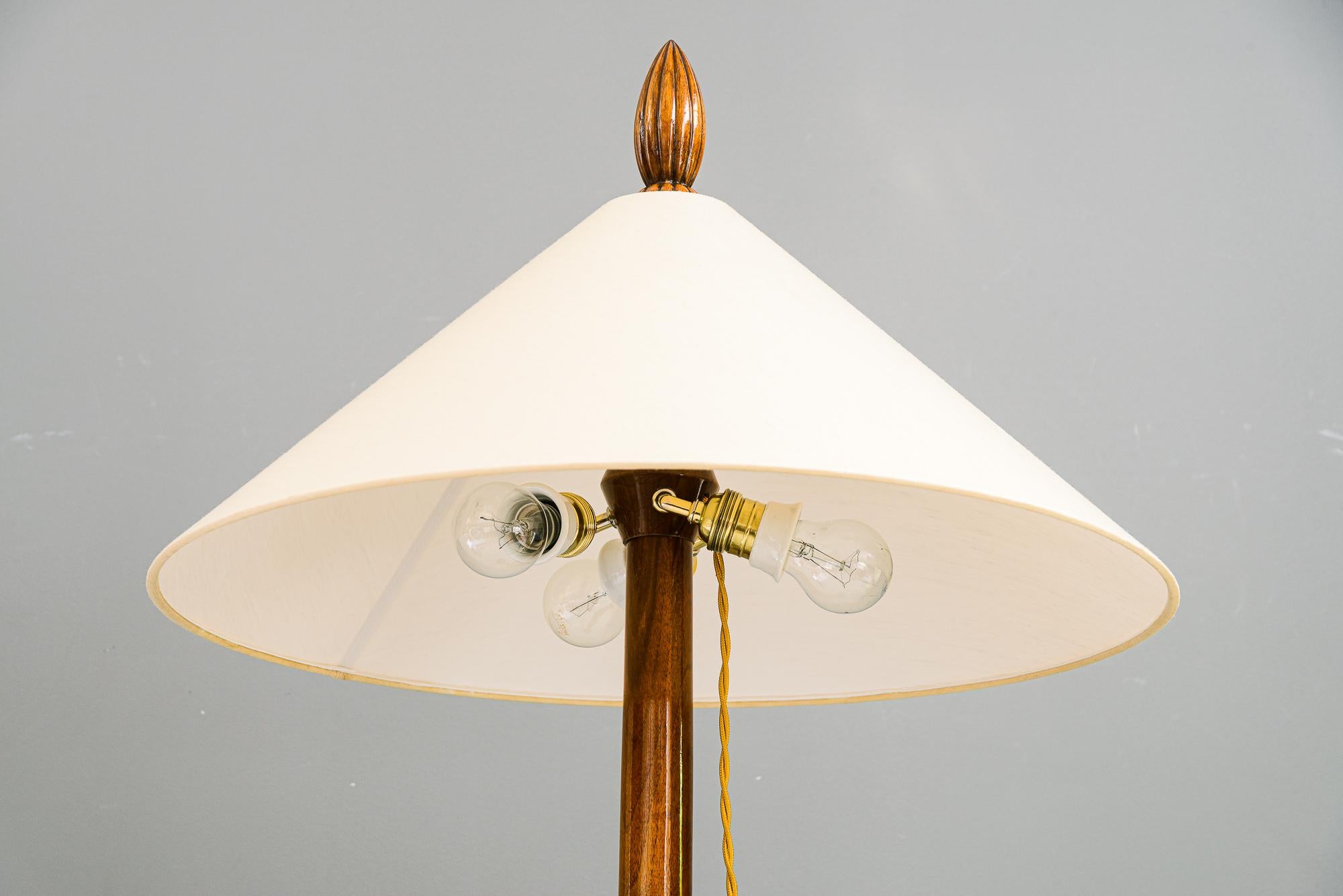 Polished Floor lamp nut wood with fabric shade vienna around 1950s For Sale